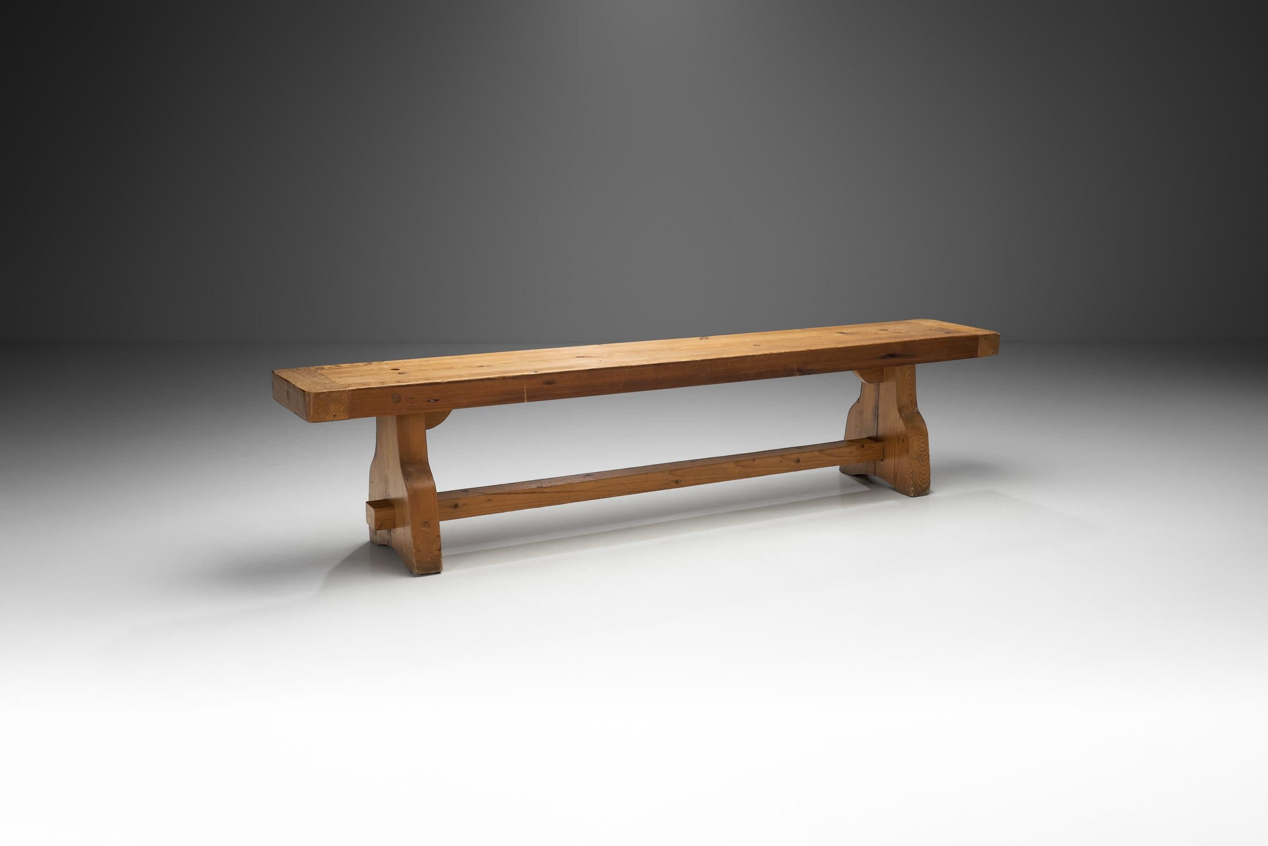 In European mid-century design, there was an early emphasis on wood as it connected everyday objects, such as furniture to nature. This rustic, solid oak wood bench is a perfect example of this sentiment, and of the visual benefits of an