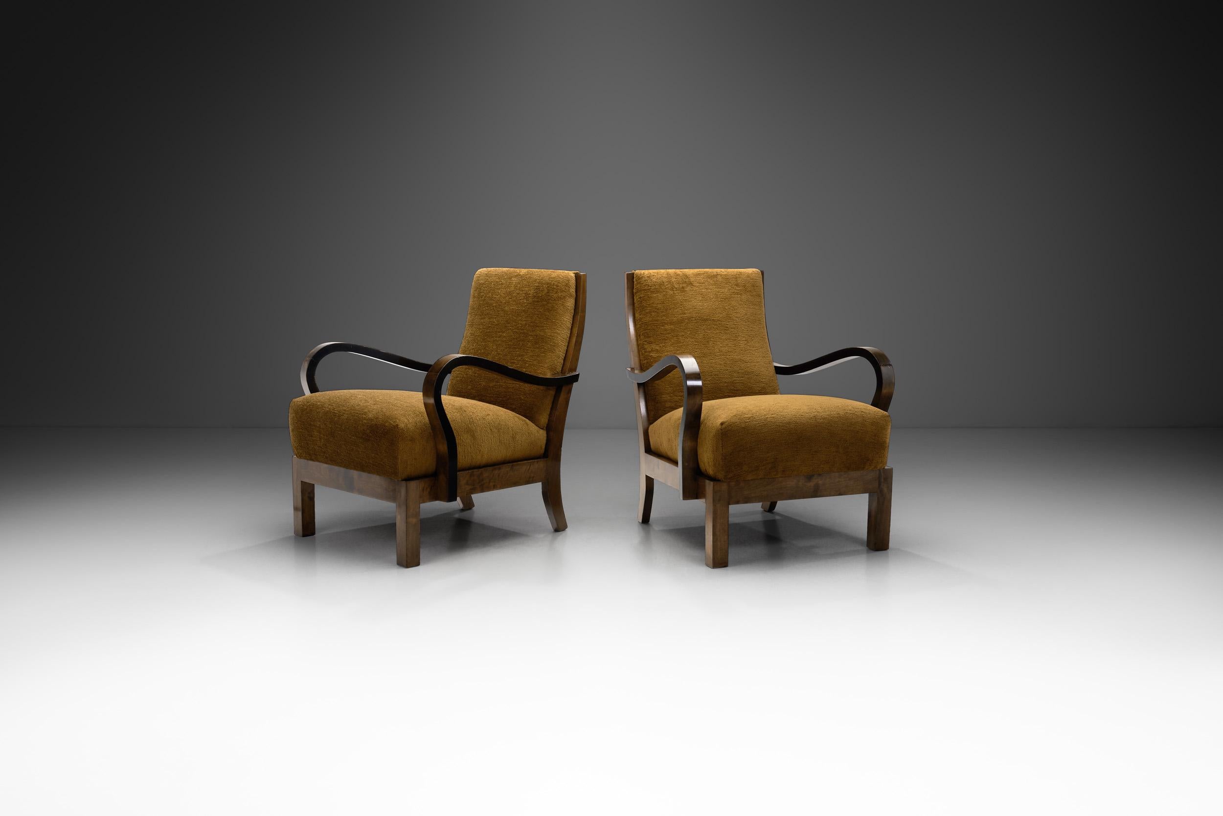 This elegant pair of armchairs is an interesting bridge between the 20th century’s earlier artistic movements, like Art Deco, and the modernist movement that was about to shape most of Europe’s furniture design for the coming decades.

Inspired by