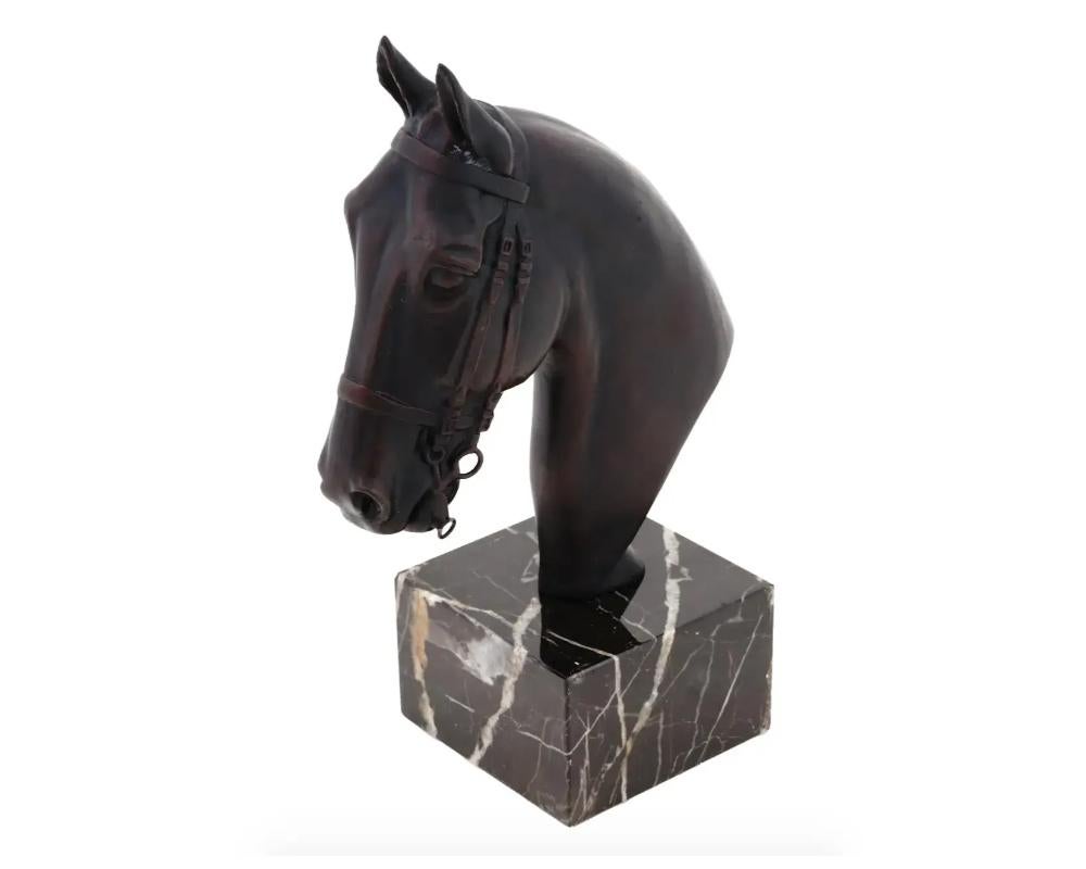 A European equestrian cast bronze bust. The bust depicts a head of a horse, engraved with detailed patterns. Mounted on a solid marble base. Circa: the first half of the 20th century. Vintage and Modern Animal Bronze Busts, Sculptures, Figures,