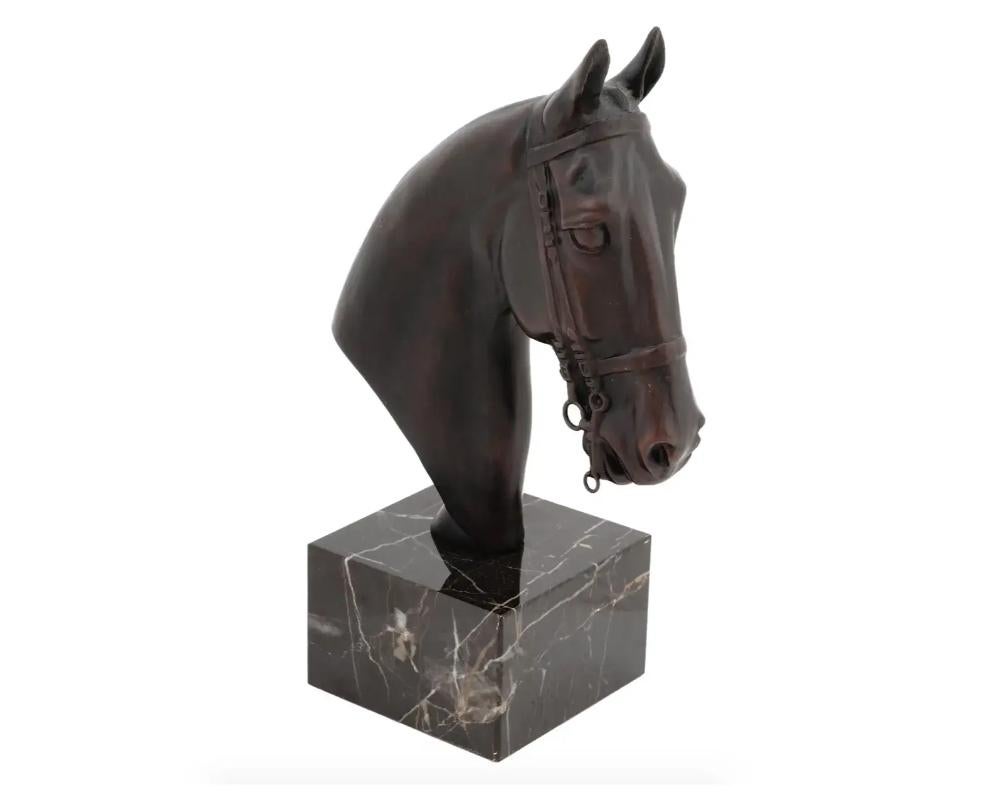 A European equestrian cast bronze bust. The bust depicts a head of a horse, engraved with detailed patterns. Mounted on a solid marble base. Circa: the first half of the 20th century. Vintage and Modern Animal Bronze Busts, Sculptures, Figures,