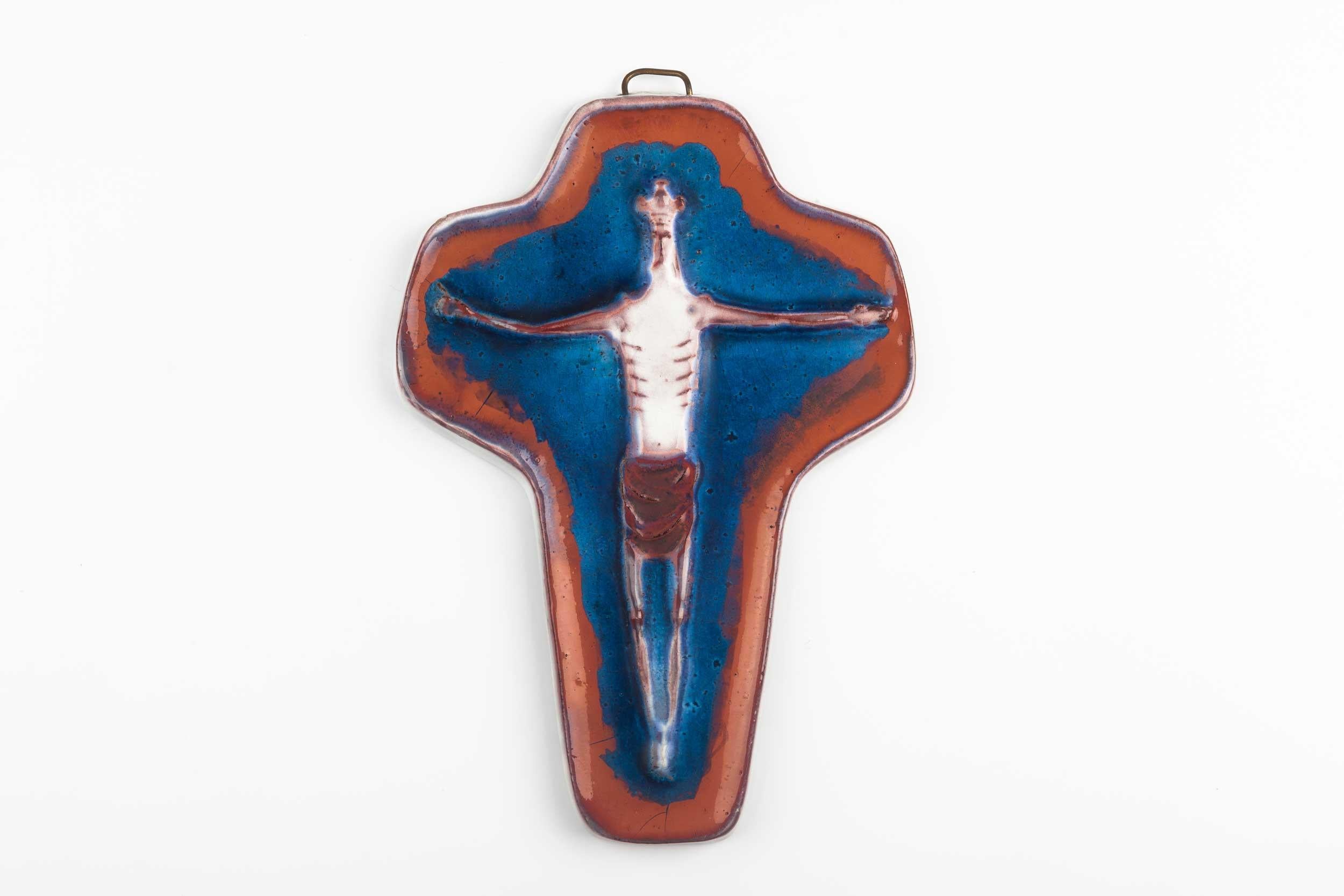 Mesmerizing midcentury European wall cross hand painted in white, sienna and blue with an abstracted and otherworldly Christ figure. Not your granny's typical cross, but one you could gift her. 

Dimensions
H 9.25 in. x W 6.5 in. x D .75 in.
H