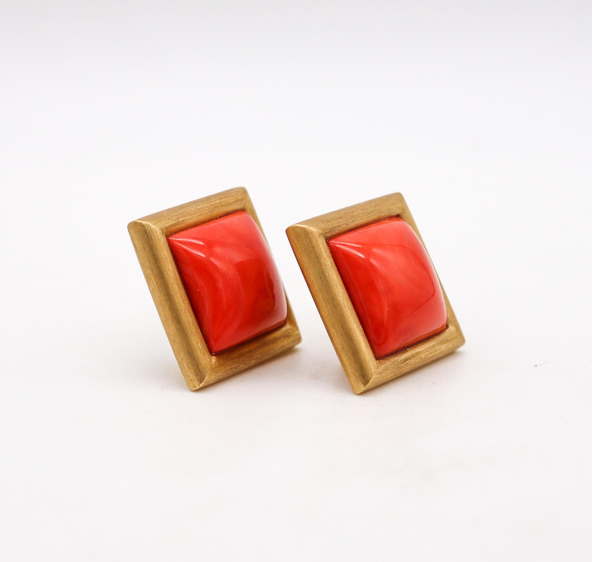Magnificent clip-on earrings with Italian coral.

Fabulous pair of contemporary clips-on earrings, created in Europe in the late 20th century. They was crafted with squared shape in solid yellow gold of 18 karats with textured brushed finish and