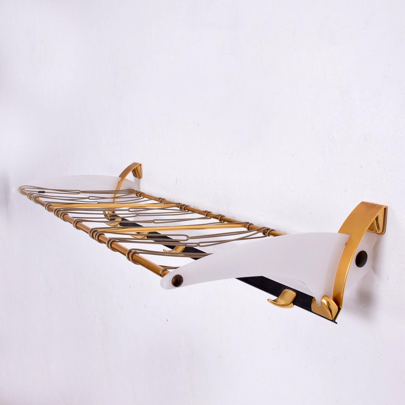 For your consideration a vintage coatrack.

Modern design with powder coat black steel, plexiglass and brass (aluminium anodized with brass finish).

Unique clean modern look. 

Dimensions:
13 1/4