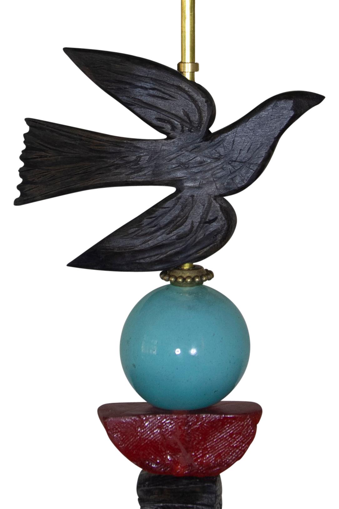 This contemporary Margit Wittig table lamp sits on a rectangular slate base and includes a hand blown glass sphere in blue. The sculpted contemporary bird in flight, with its organic texture is a signature of Margit Wittig's work. The materials