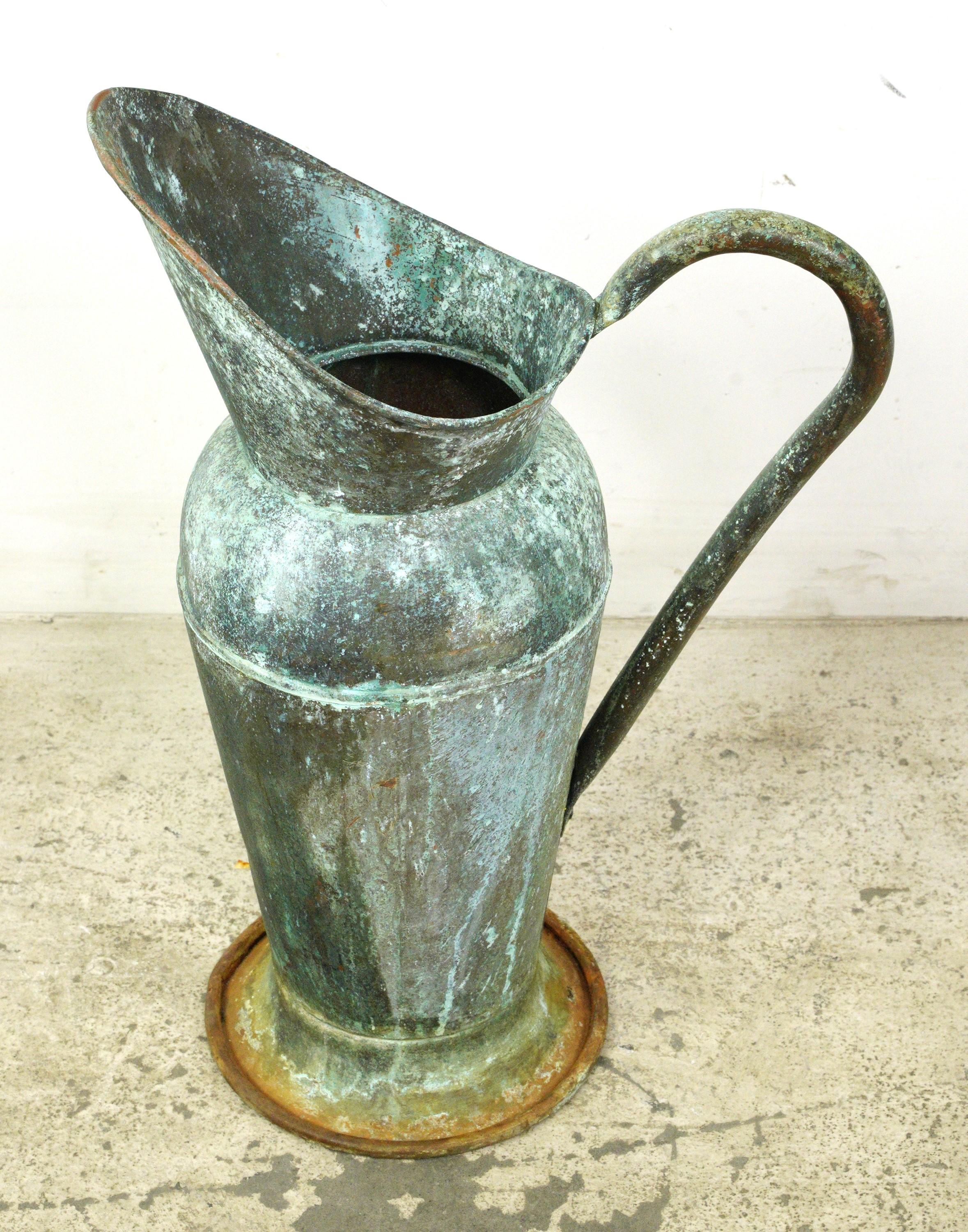 Early 20th Century copper jug with a verdigris patina. Good condition with appropriate wear from age. One available. Please note, this item is located in one of our NYC locations.