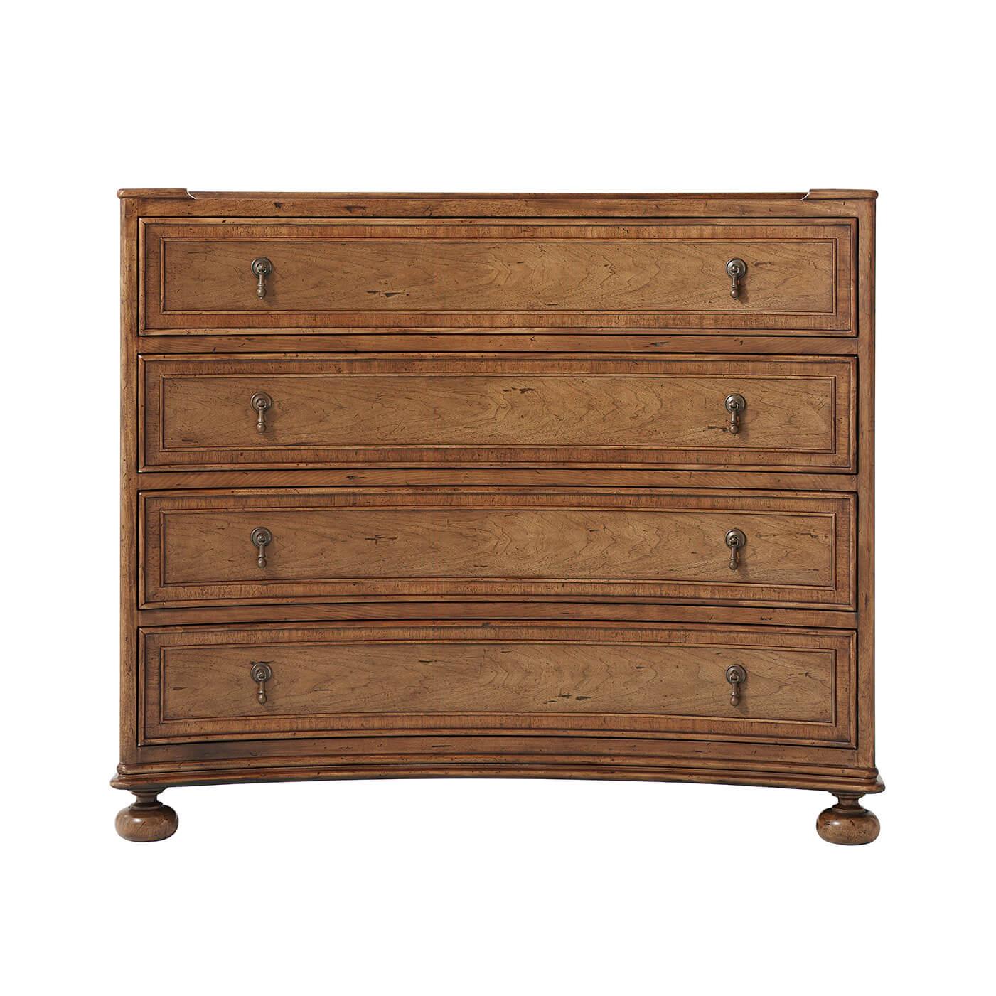 European concave form walnut and mahogany chest of drawers with a three-quarter gallery, aged Baroque walnut finish, four-paneled drawers with drop handles and raised on bun feet.
Dimensions: 45.25