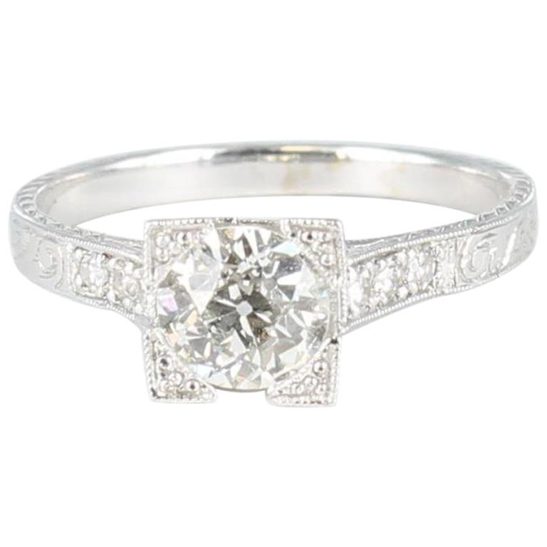 European Cut .67 Carat Center Diamond Engagement Ring Set in 18 Karat White Gold For Sale