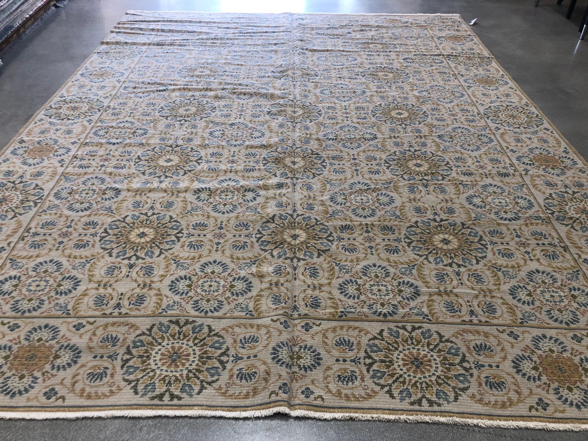 The bright gold and blue hues of this European Design collection area rug bring to mind a sun-drenched tile terrace in Spain. For the family room, sun room or any space that calls out for color and light. Hand knotted wool, made with vegetal