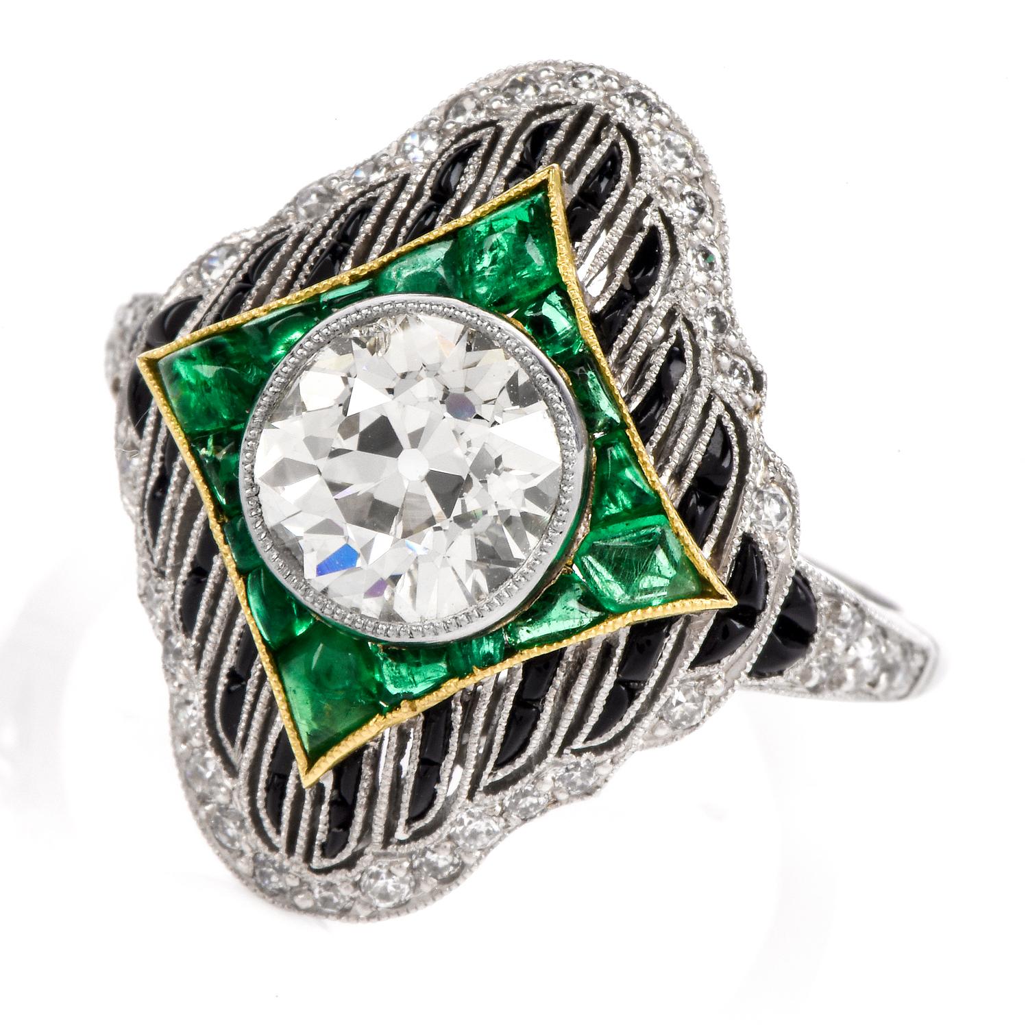 this vintage  stunning diamond, emerald, and onyx ring is crafted in solid platinum. Showcasing a prominent bezel-set round old European-cut diamond weighing approx. 1.66 carats, graded I-J color, and VS1 clarity. Surrounded by a kite shaped frame