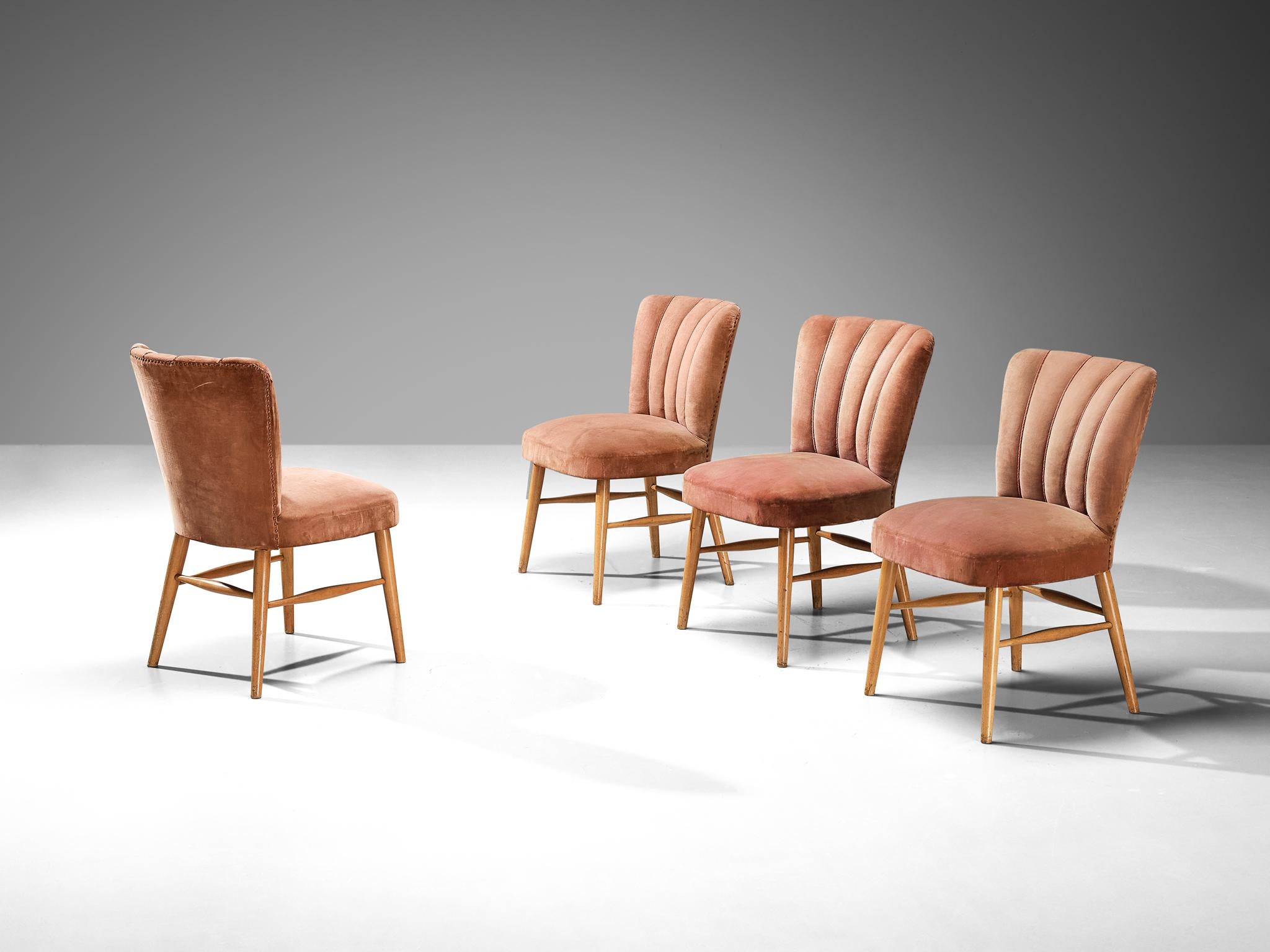 Dining chairs, velvet, beech, metal, Europe, 1950s

Elegant dining chairs in a soft pink velvet upholstery. A beech frame with armrests holds the seat and backrest that is highlighted with vertical lines ending in soft curves on top. The tufted