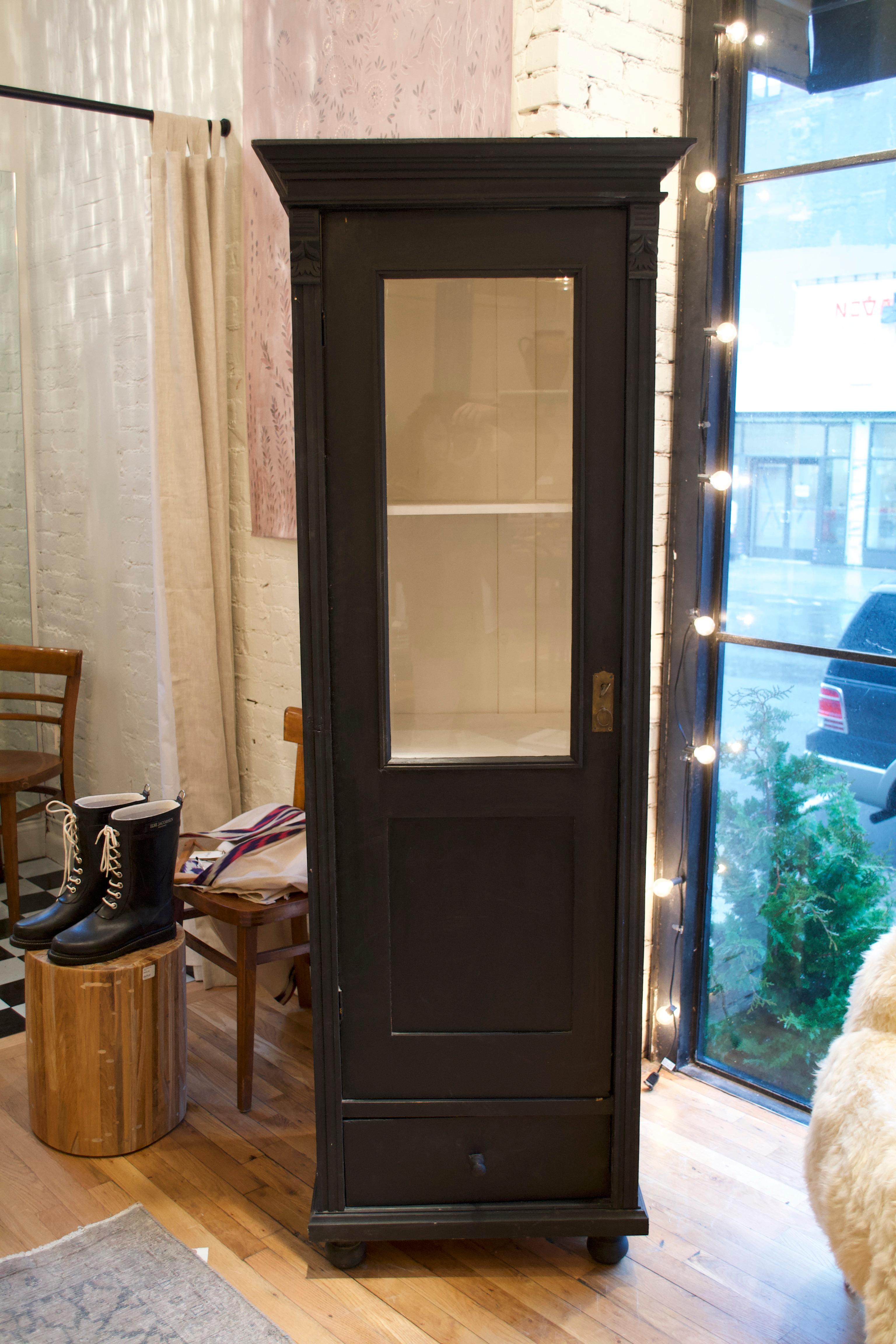 European black painted vitrine with white interior. A great addition to display linens in a countryside bathroom.