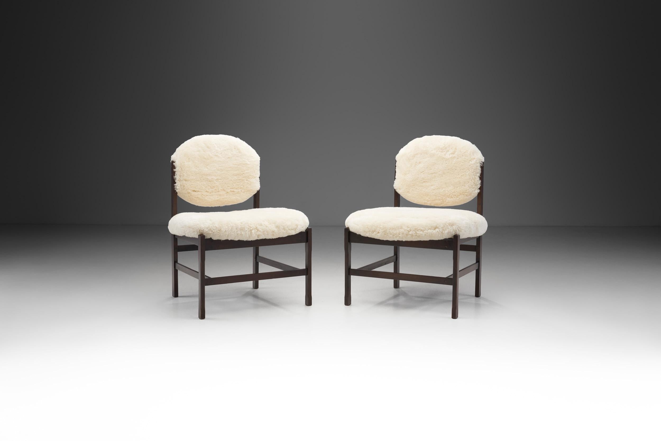The period from the 1940s through the 1960s was a high point for European furniture makers. This pair of easy chairs were created during this period of creative overflow, with a typically European mid-century modern style.

The chairs’ simple and