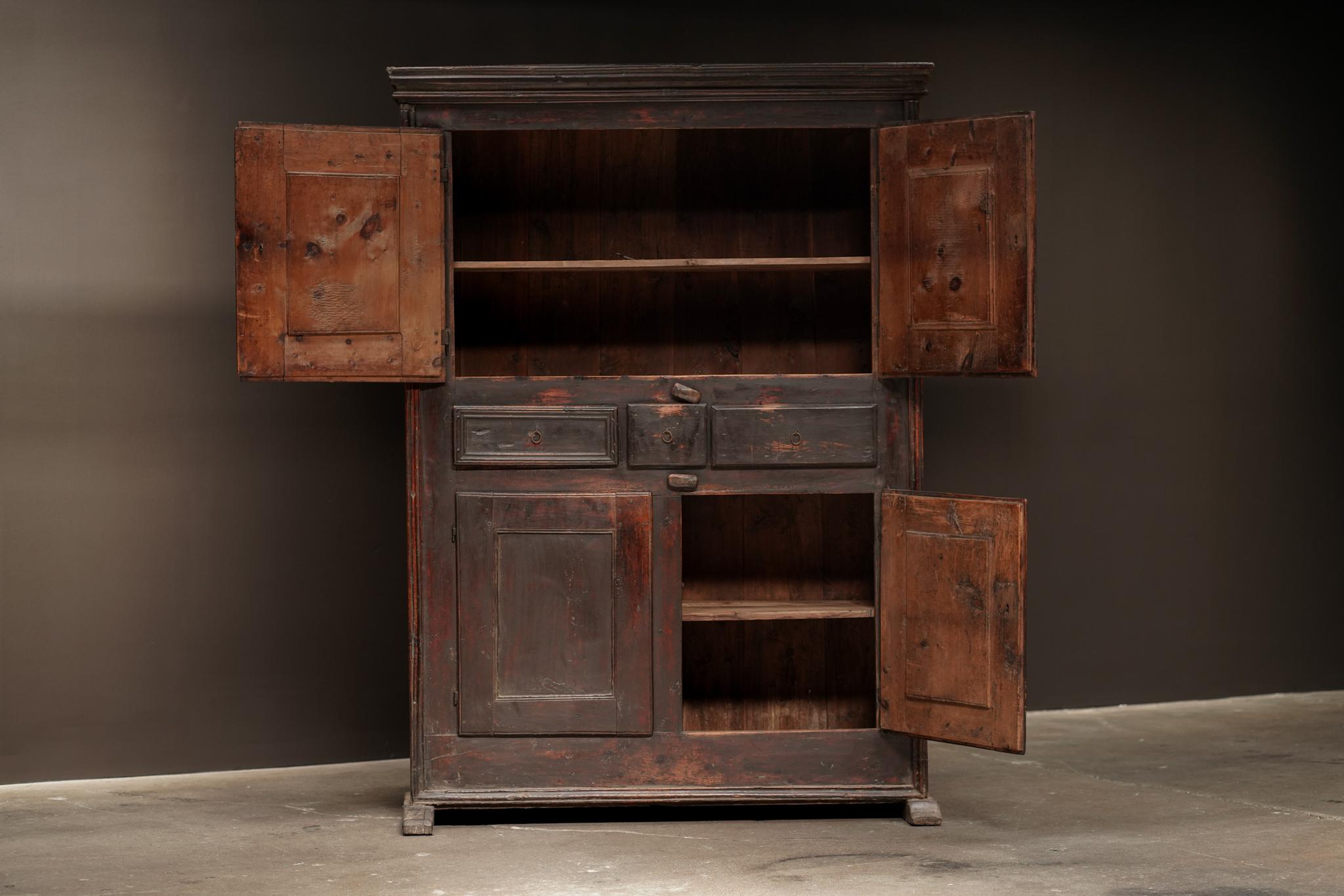 Ebonized Large Cabinet from Europe, featuring a dark, refined finish and an interior marked by aged patina. Fitted with multiple drawers, it offers generous storage and a strong, functional design.