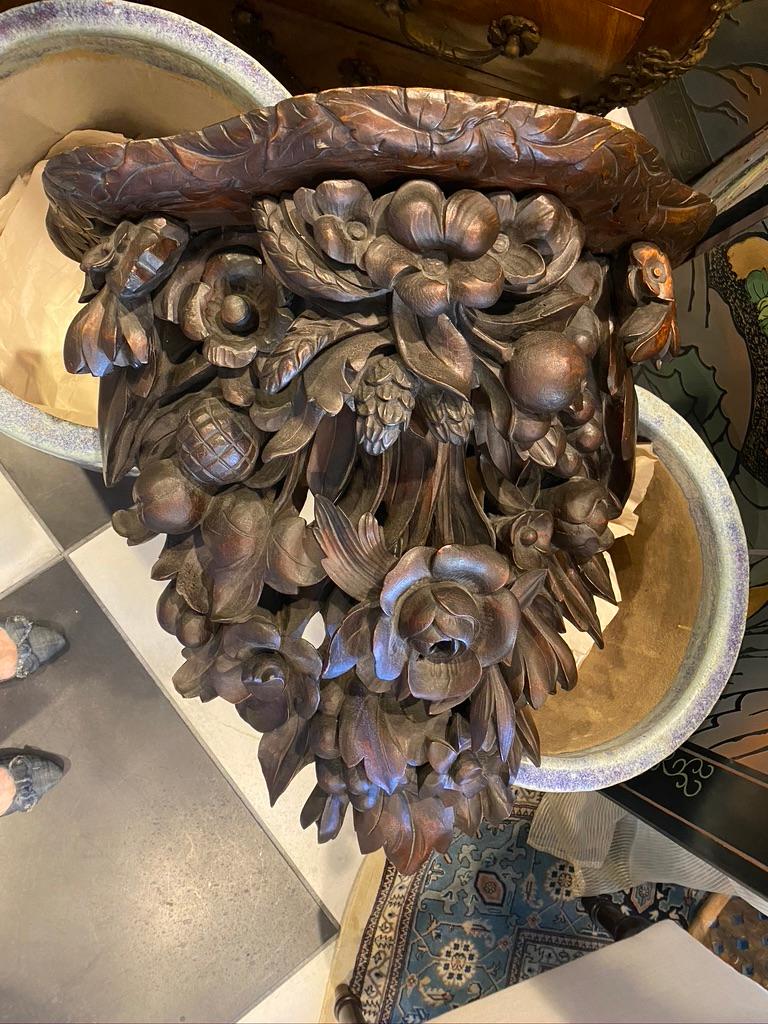 This piece is a one of a kind. European Extra-large wooden hand carved sconce having fruit and flowers throughout. This would made a wonderful entry way 