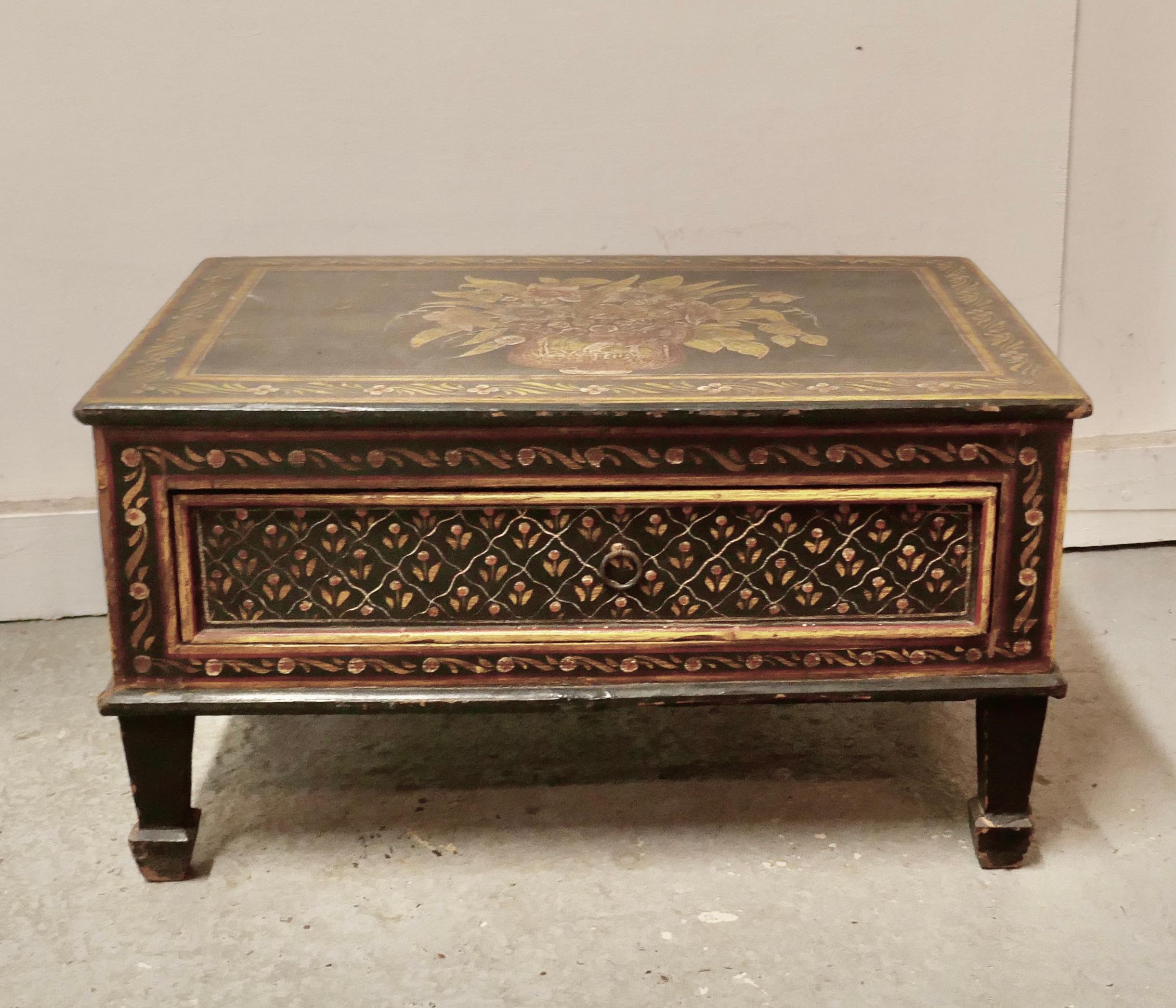 European Folk Art painted low table with drawer

This is a lovely piece, it has painted floral decoration, it stands on small legs and has a drawer to the front 
A delightful and useful piece, in good aged condition
The table or stool is 24”