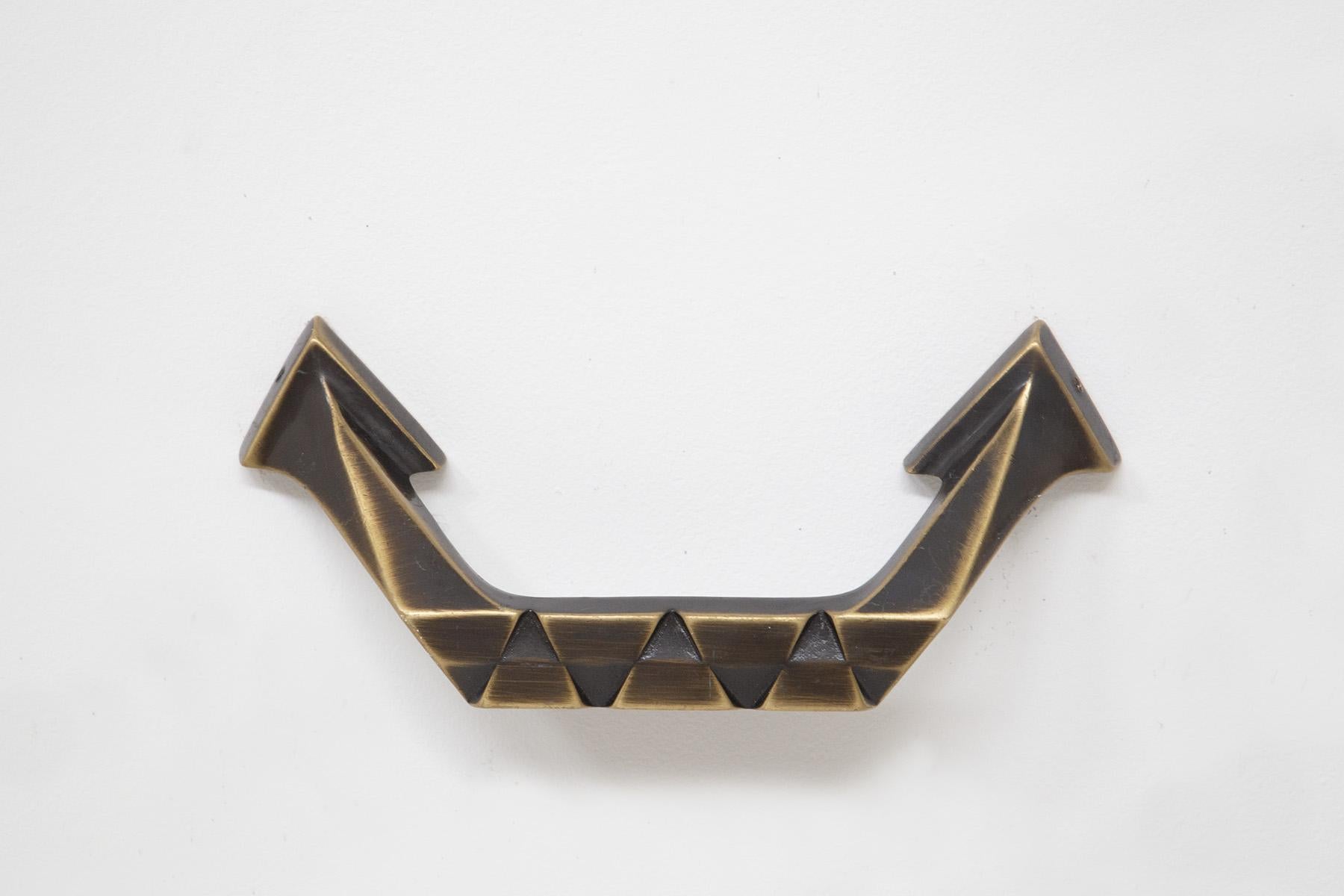 Pair of large brass handles from the European Futurist era. The handles date from the 1920s-30s. They were made entirely of brass with great skill and workmanship. The handles have a precise geometric line almost angular typical of the futurist