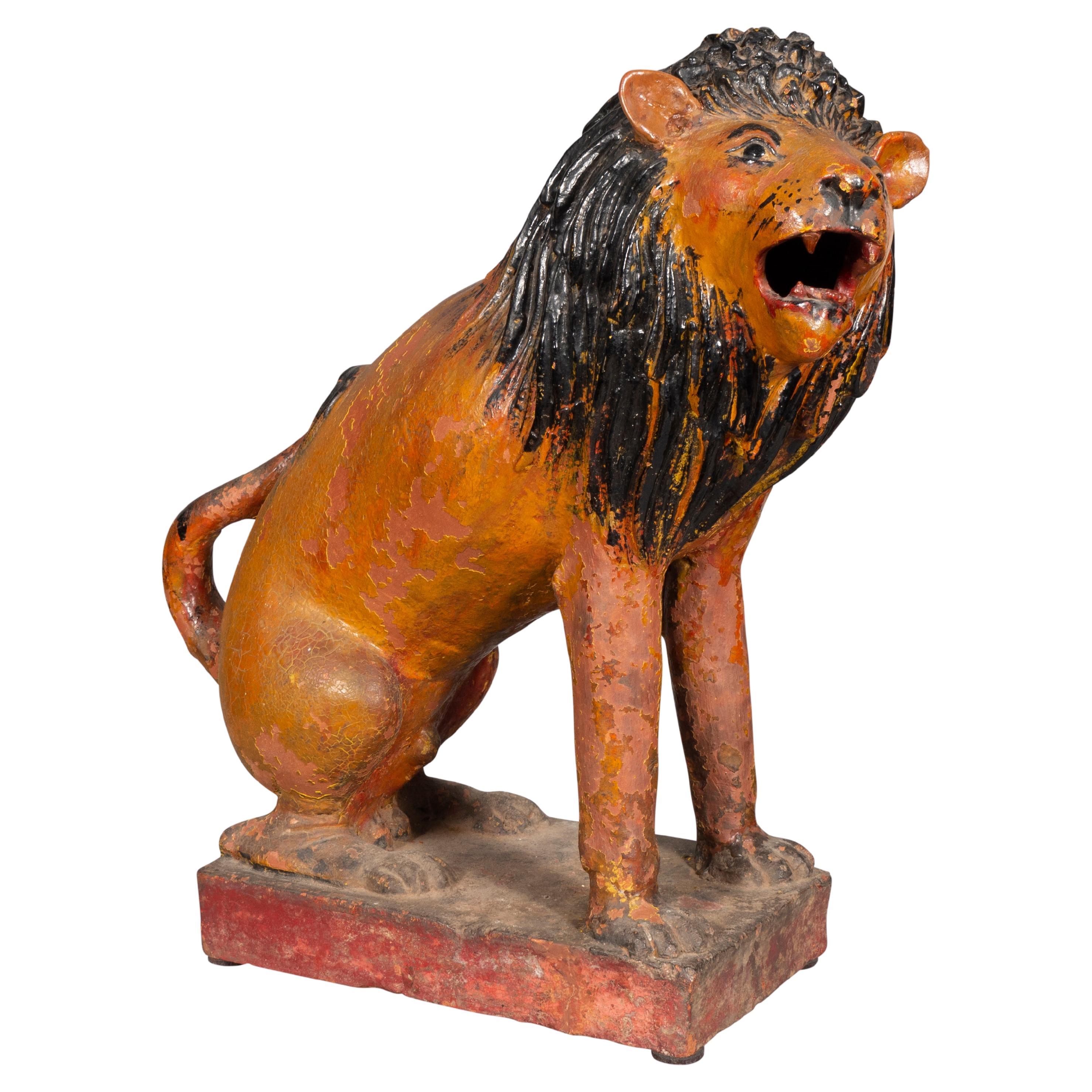 The proud lion seated letting out a roar. On a plinth base.
Used in the movie 