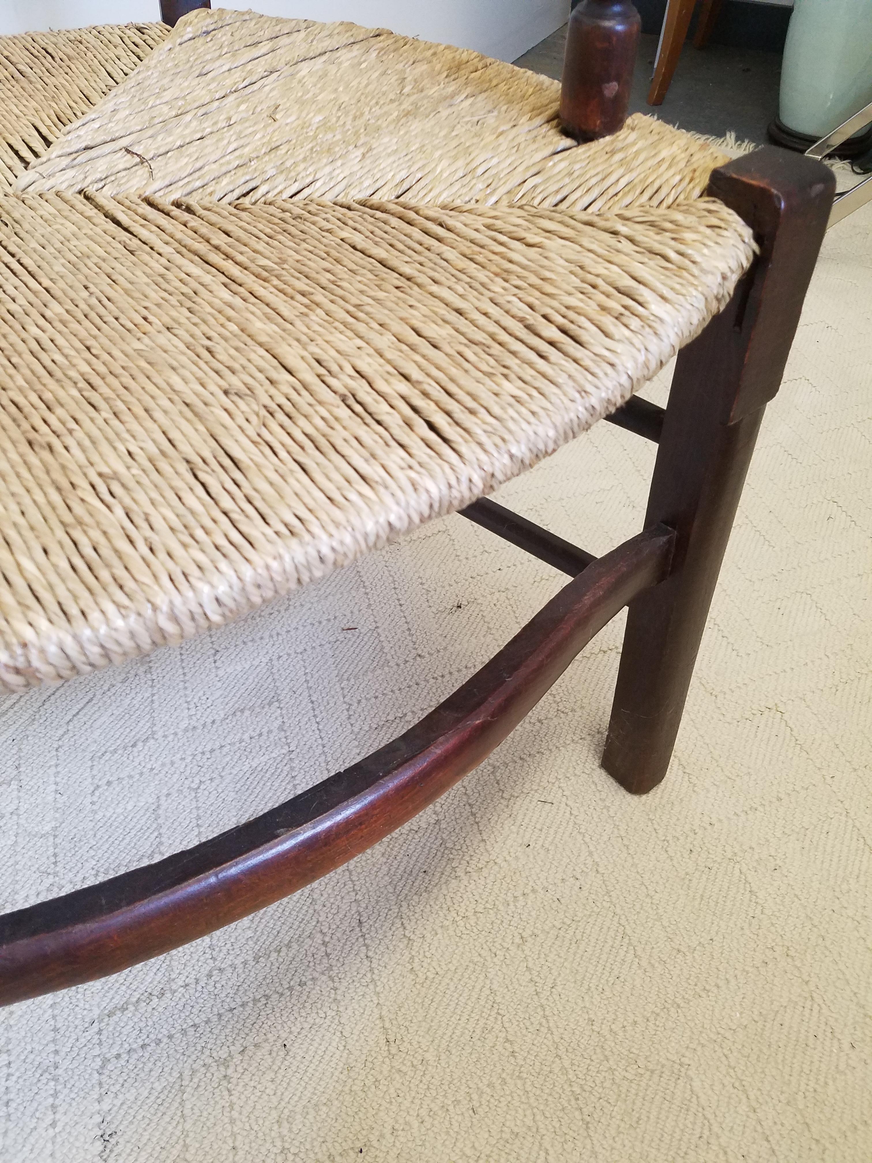 European Hand Carved Dark Oak Armchair with Rush Seat In Excellent Condition In Lambertville, NJ