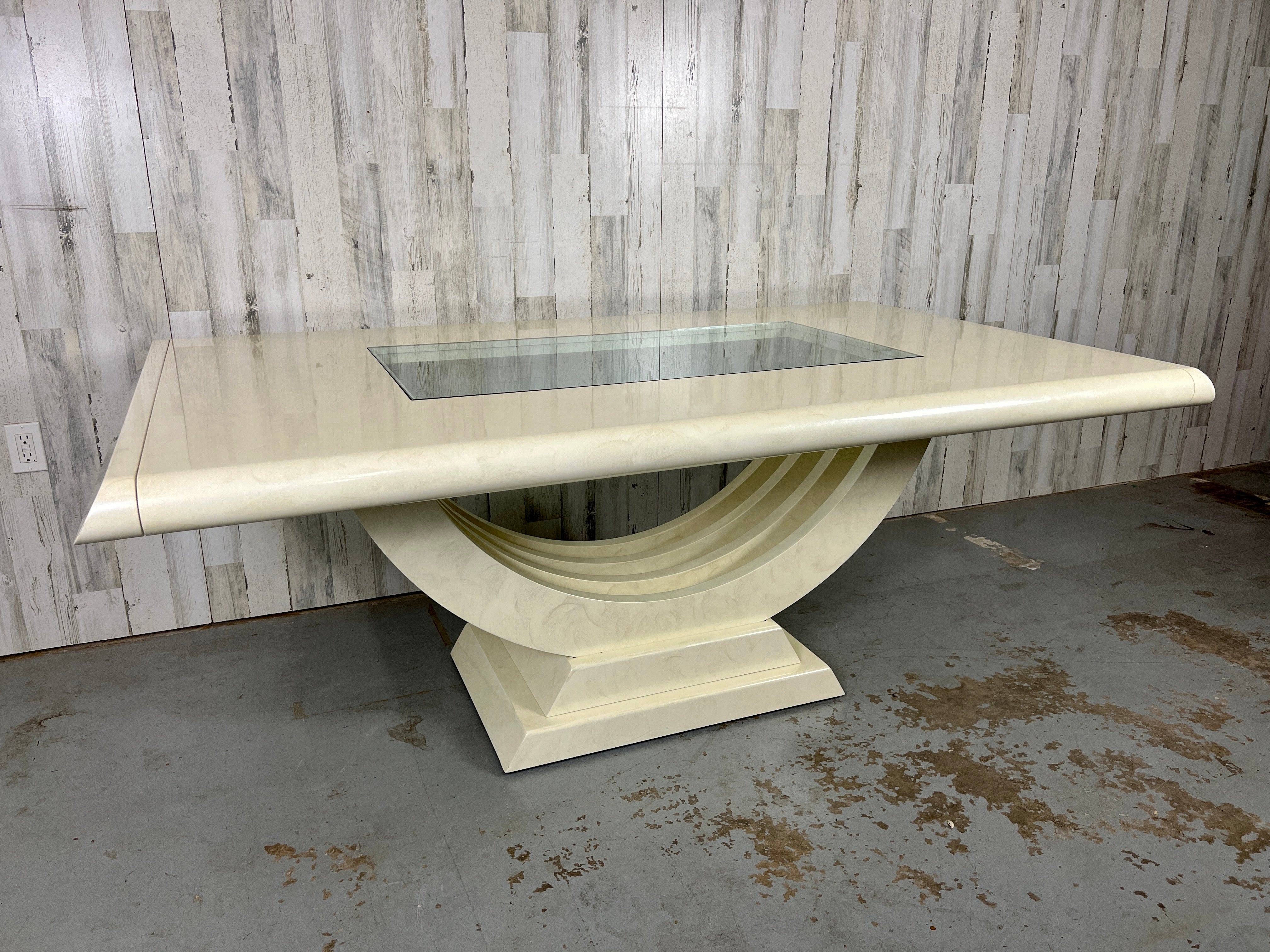 Extendable European Hand Painted Art Deco Dining Table. Off white color with hand painted swirls throughout. This table is truly one of a kind! 

With leaves at each end measures to be 112