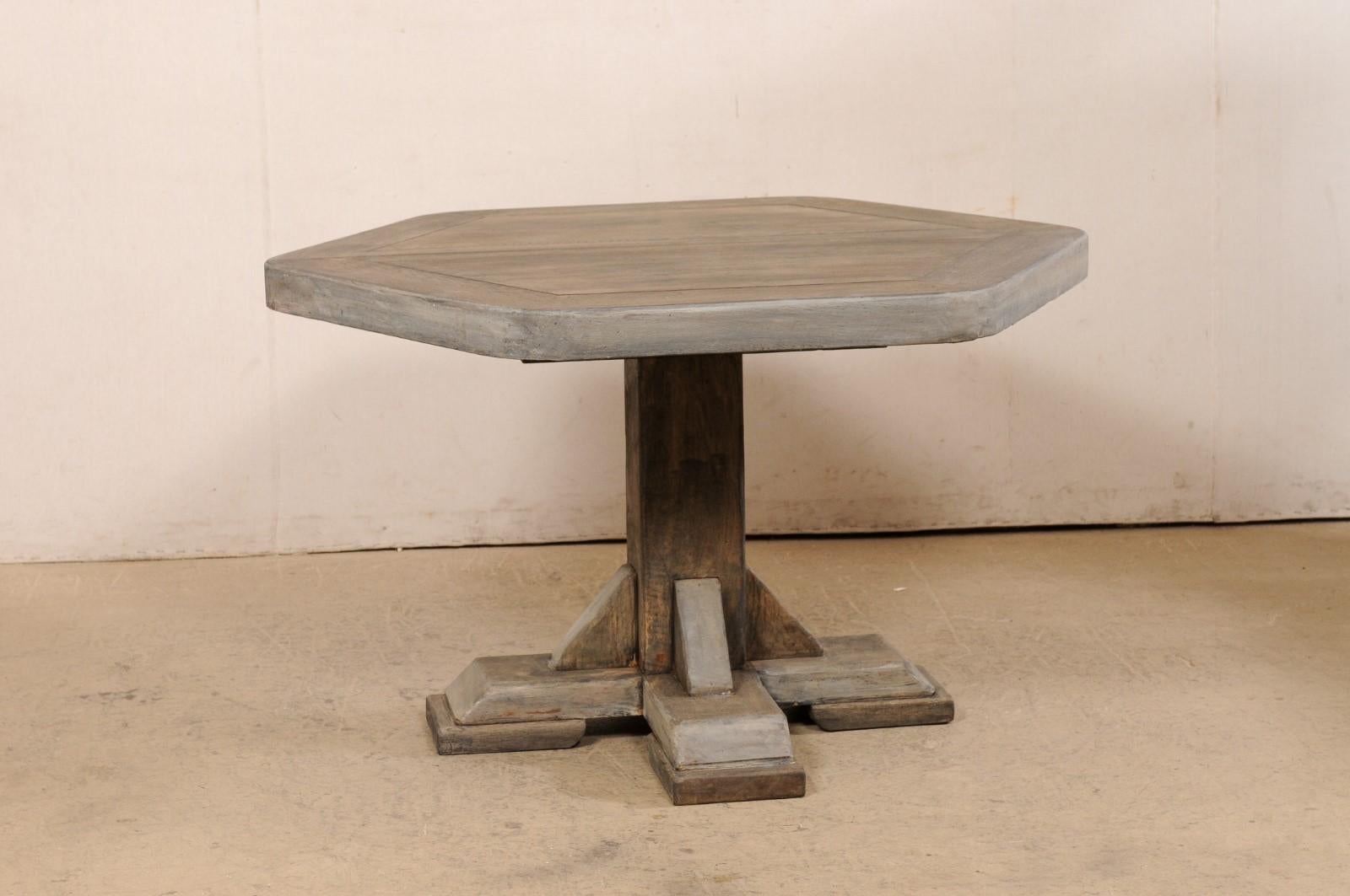 A European hexagonal wood table from the mid 20th century. This mid-century table from Europe has a 2.75