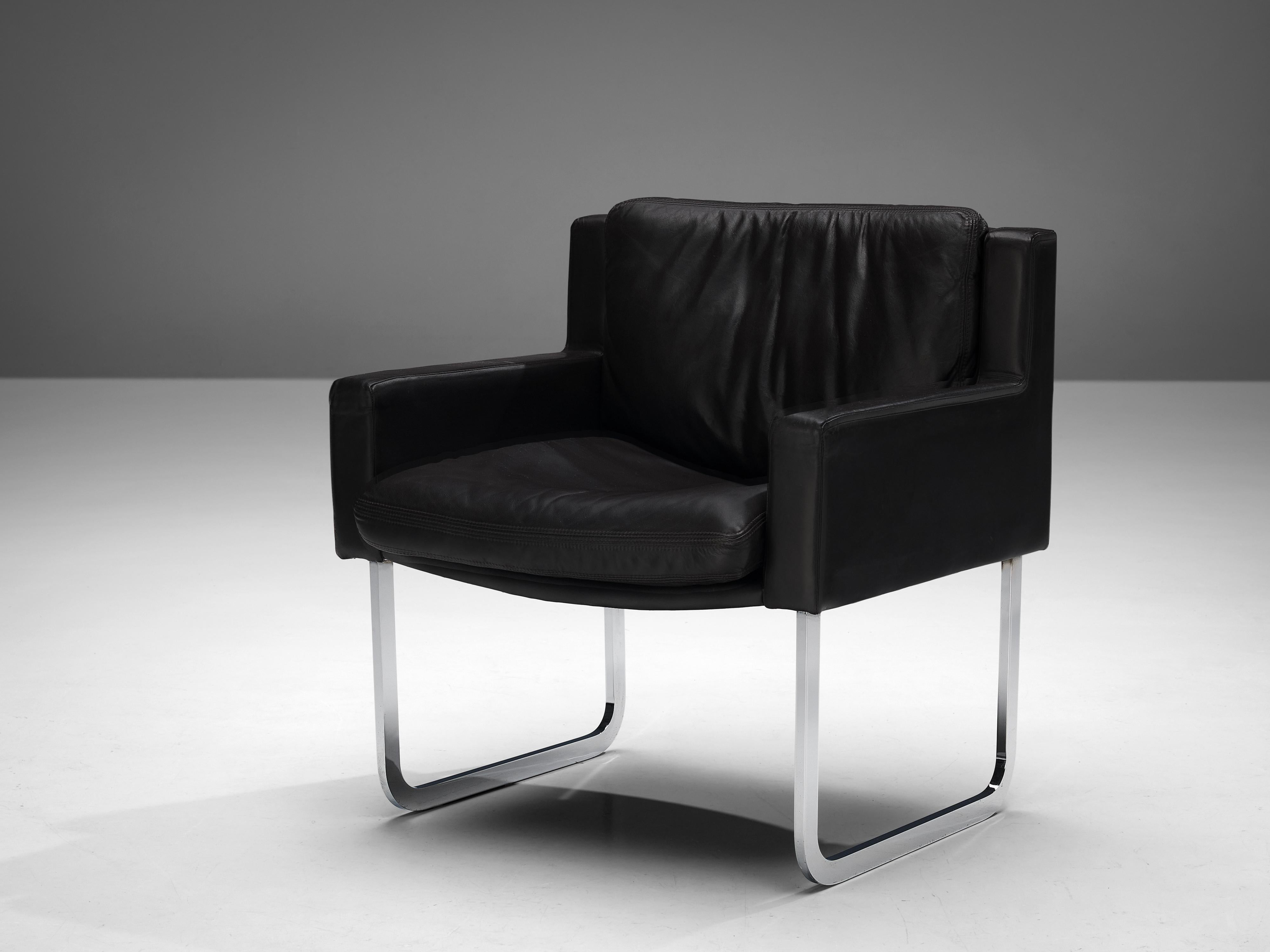 Lounge chair, leather, metal, Europe, 1980s

This comfortable lounge chair lays full focus on strong lines and the combination of two materials. Upholstered in dark brown leather and resting on two u-shaped legs in chrome, the chair convinces with
