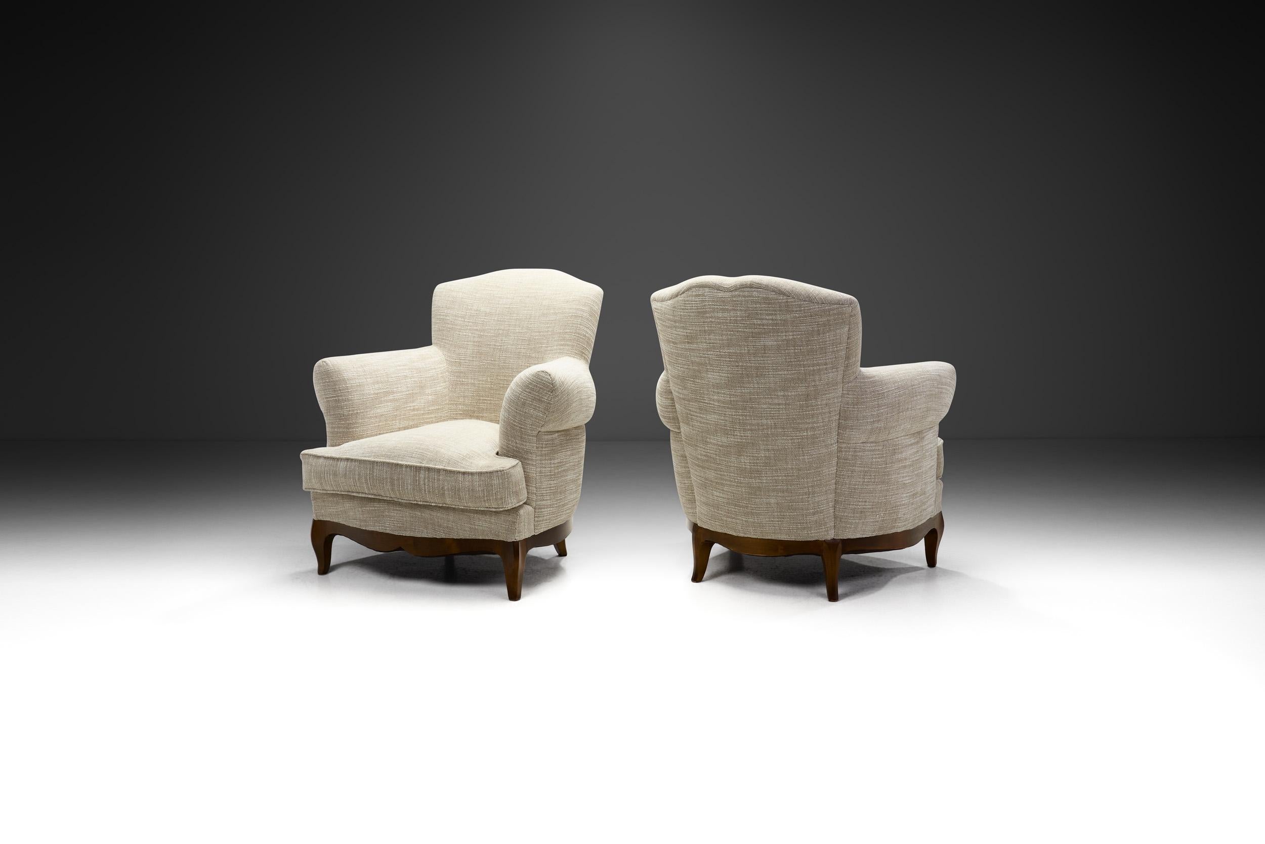 These unique, elegant lounge chairs take stylistic inspiration from both French period and Italian modern seating designs. The design incorporates beauty, functionality, and simplicity in a way that is characteristic of the mid 20th