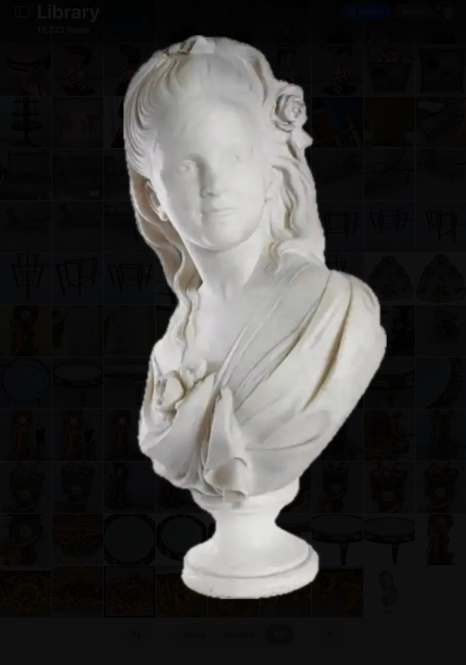 19th century Marble Bust Of A Young Girl in a graceful pose. The bust embodies the neoclassical ideals of the era, capturing the both youthful beautiful and refined elegance. The solid white marble bust depicts a youthful face highlighting the eyes,