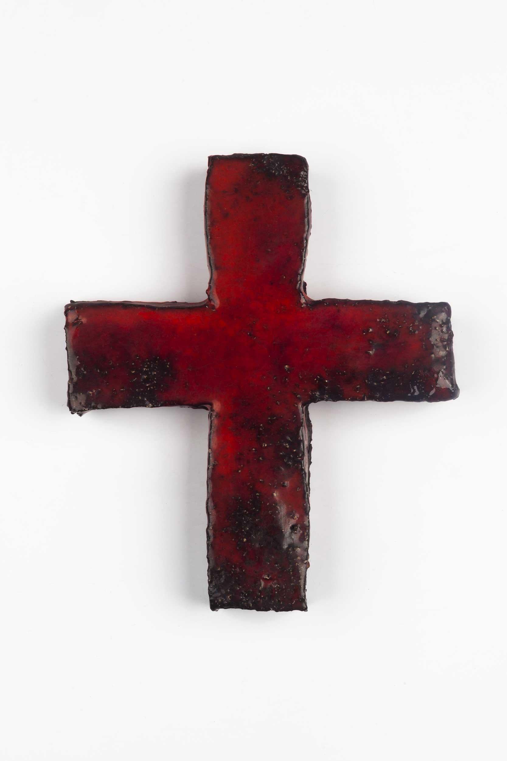 Small, thick, textured cross in glossy glaze with brilliant depth of color in the red and black hand-painted clay. 

Dimensions

H 5 in. x W 5 in. x D 1 in.
 

This piece is part of curated European ceramic crucifix collection, all made in