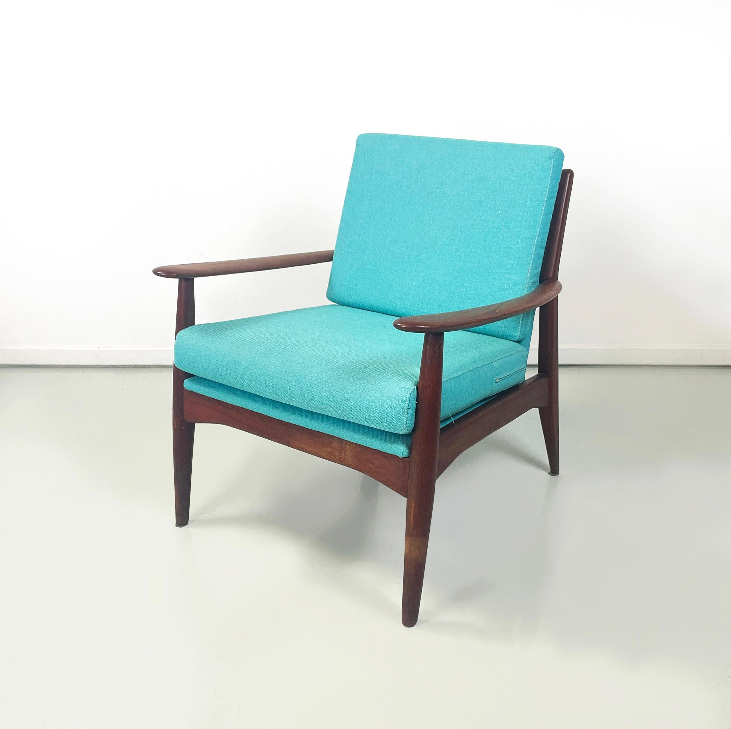 European mid-century modern Armchairs in light blue fabric and wood, 1960s
Pair of armchairs with squared seat and back, padded and covered in Tiffany light and bright blue fabric. The solid wood structure has beveled edges and soft silhouette, with