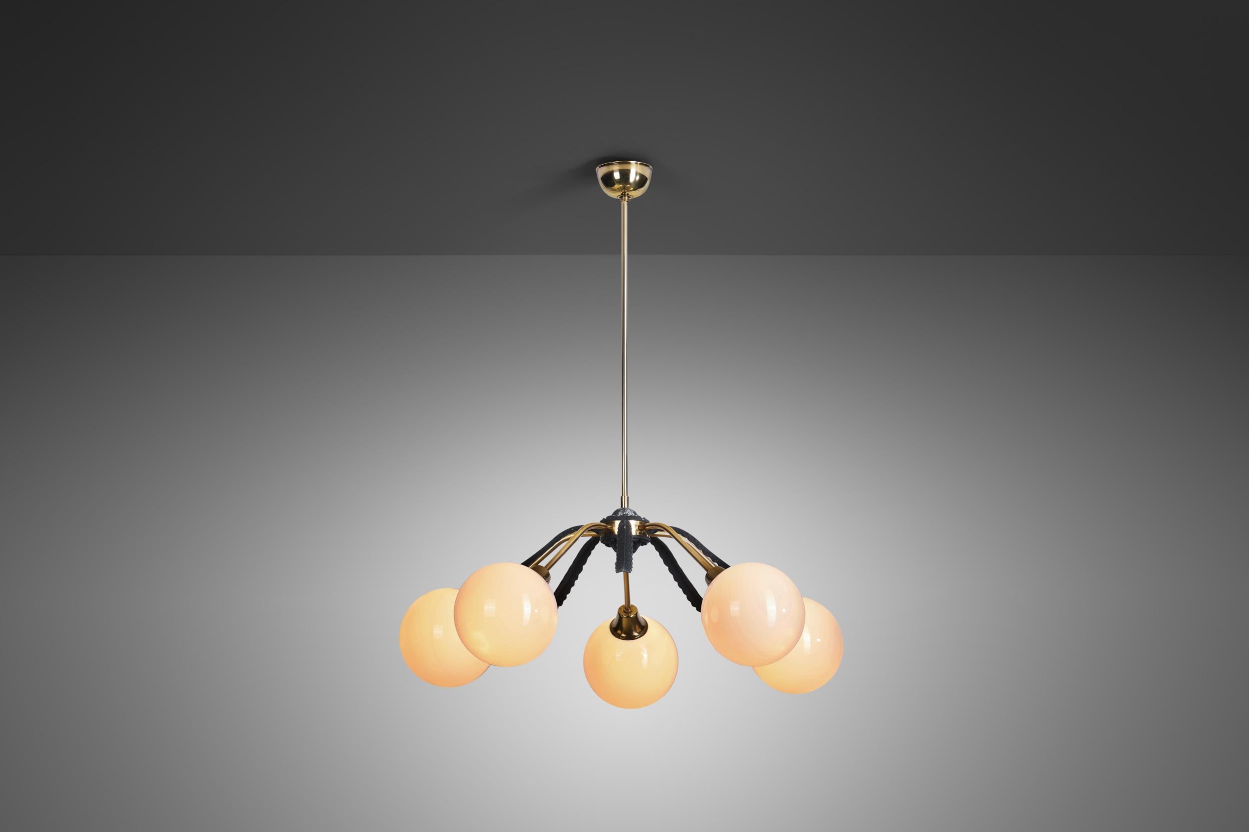 Mid-Century Modern pieces function very well because of their simplicity and fine craftsmanship. What unites the European lighting models of the era can be observed in this ceiling lamp: a clear design that can be enjoyed without being distracted by