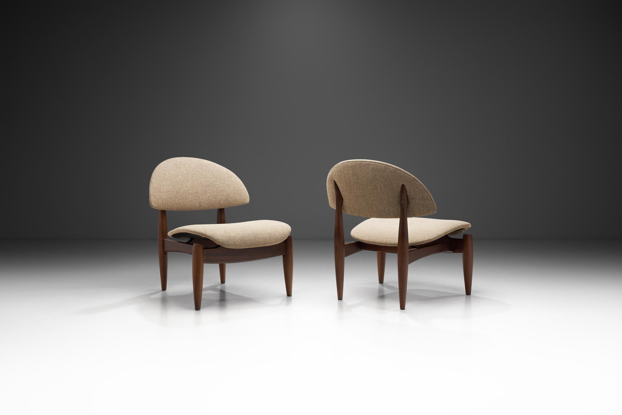 These artistic chairs have a sculptural look that is often refereed to as an “oyster”. From Finn Juhl’s “France chair” to Seymour “James” Weiner’s “Oyster” chair, this style has been popular since the mid-century era. This pair offers an interesting