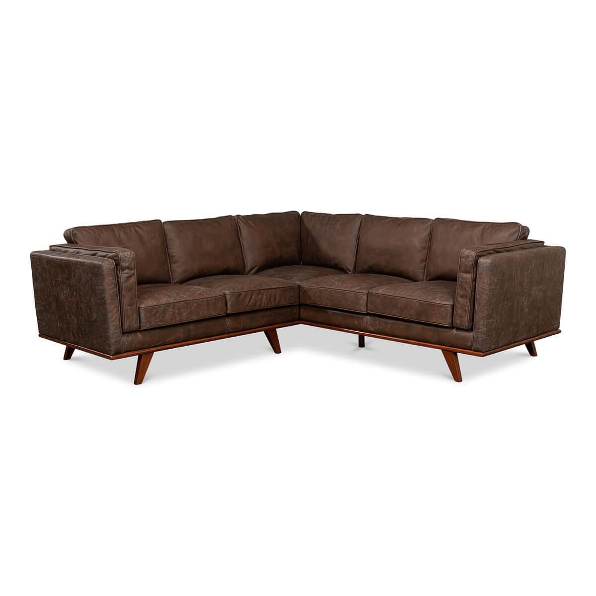 A European Mid-Century Modern style sectional sofa with antique brown leather and a dark stained maple frame with out-flaring tapered legs.

Dimensions: 91