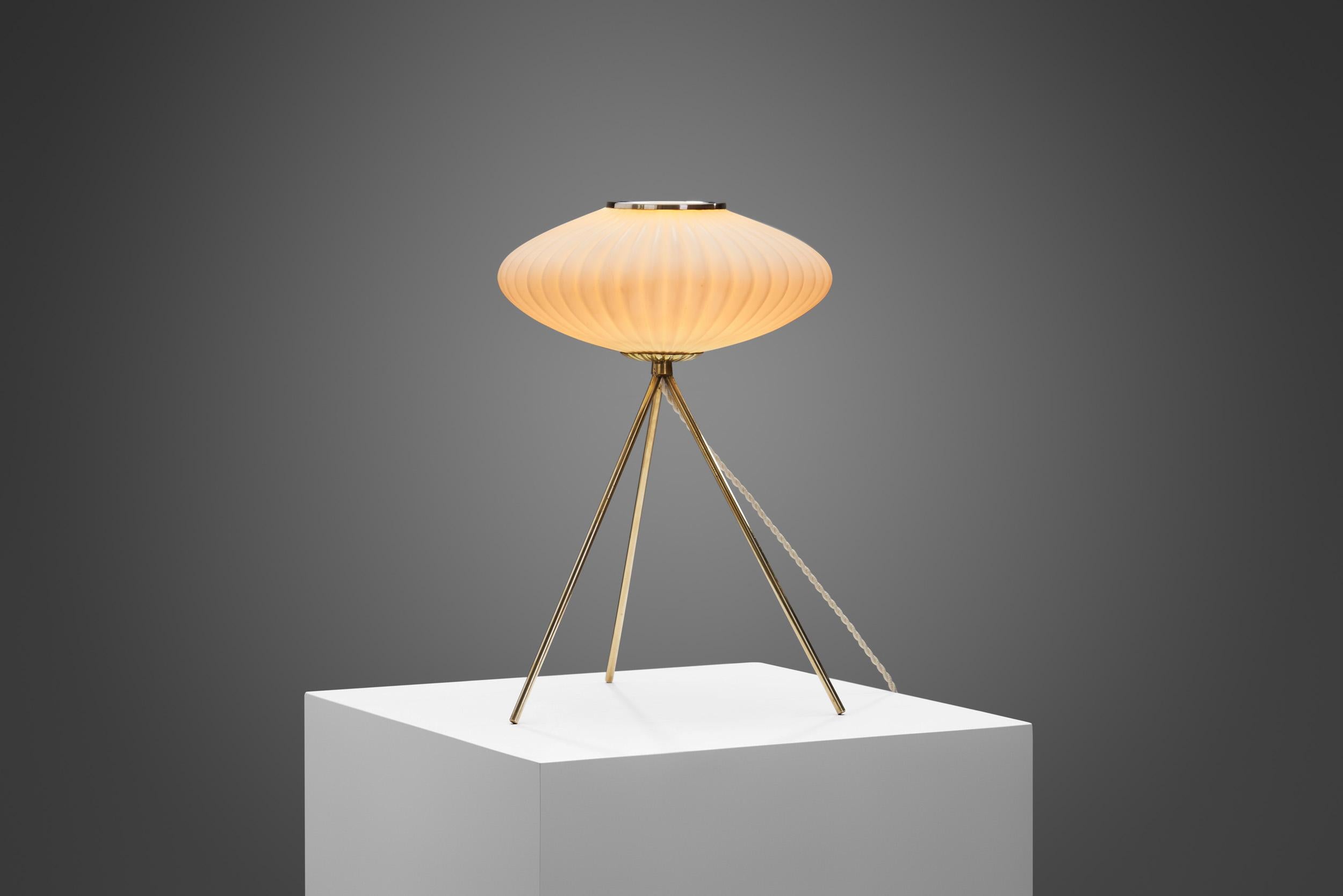 This one-of-a-kind table lamp is a delightfully distinctive model, with an immediately recognizable look. Design in the mid-century years was fuelled by the development of materials and technology with stunning results as seen in this lamp’s design.