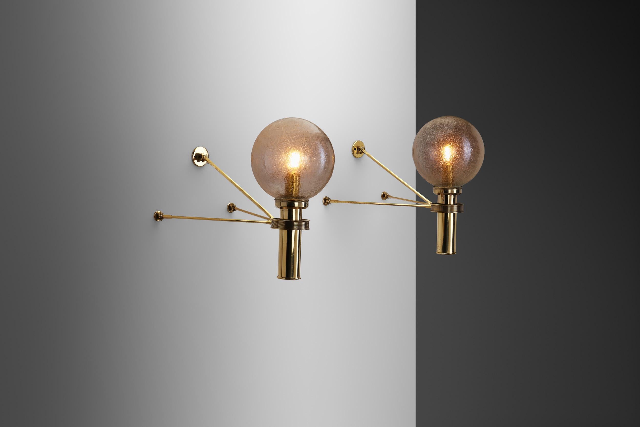 The best qualities of European mid-century designers’ light fixtures are most often their atmospheric light, disciplined, functionalist design completed by unique solutions and design elements. Exemplified by these wall lamps, these qualities are