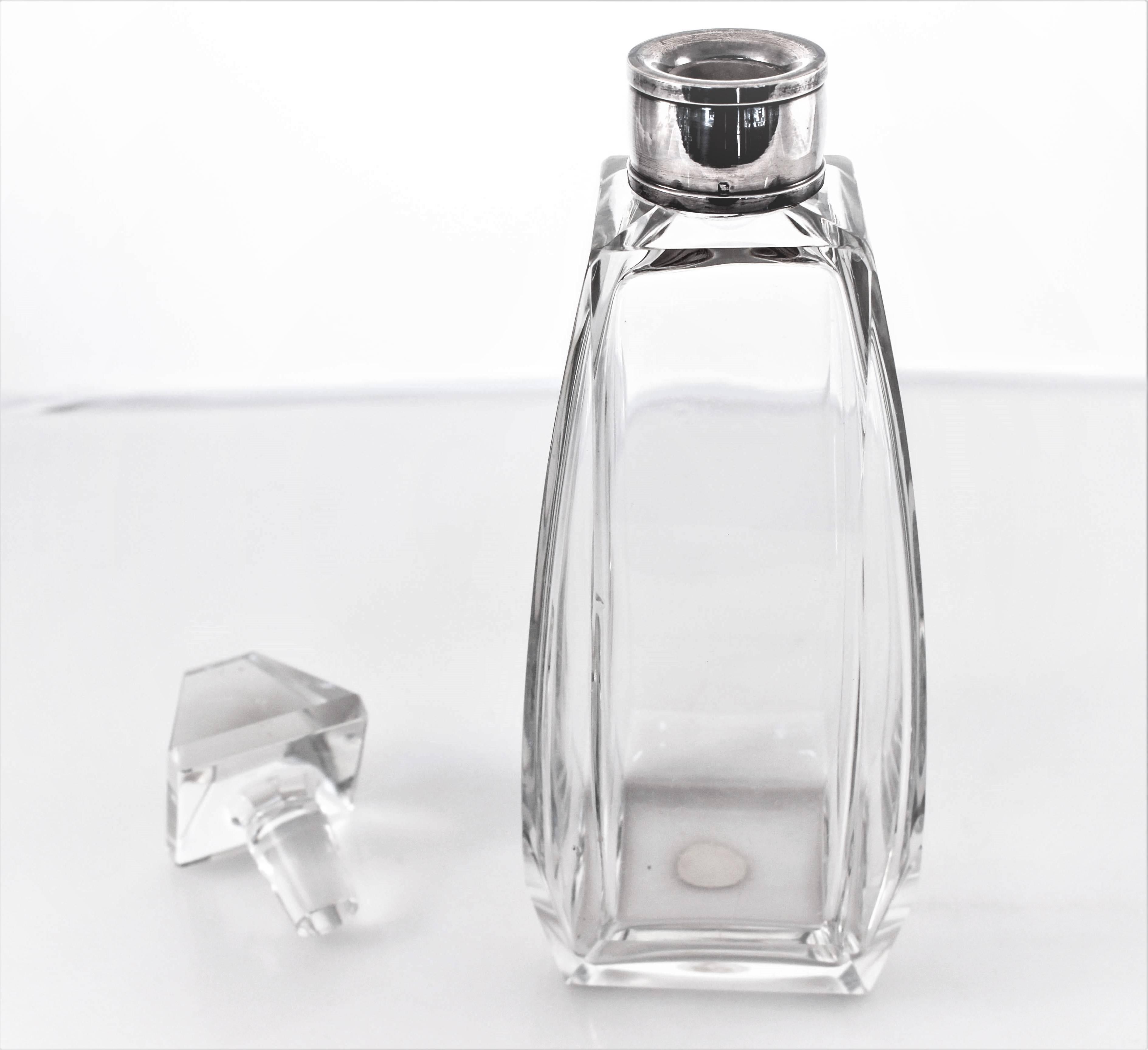 This unusual shaped decanter would be a nice addition to your bar set. Unlike most decanters that are round, this one is square, yes square. Four sided bottle with the original stopper that is four sided too. Manufactured in Germany during the