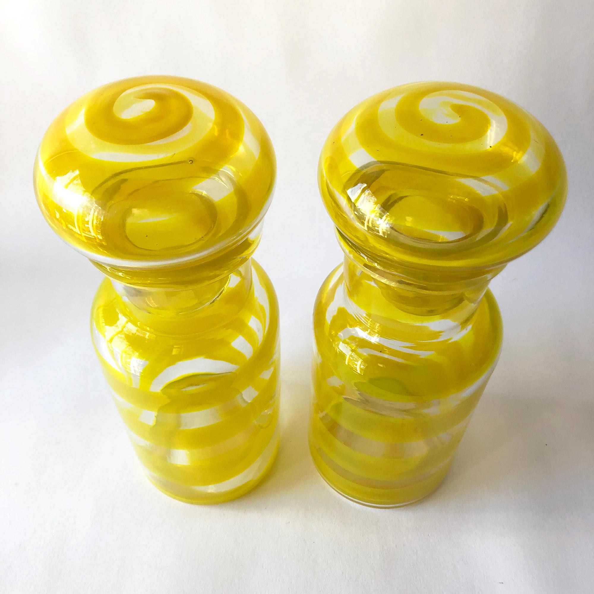 Pair of European modernist swirled blown glass decanters with mushroom stoppers, circa 1970's. Decanters measure 9.75