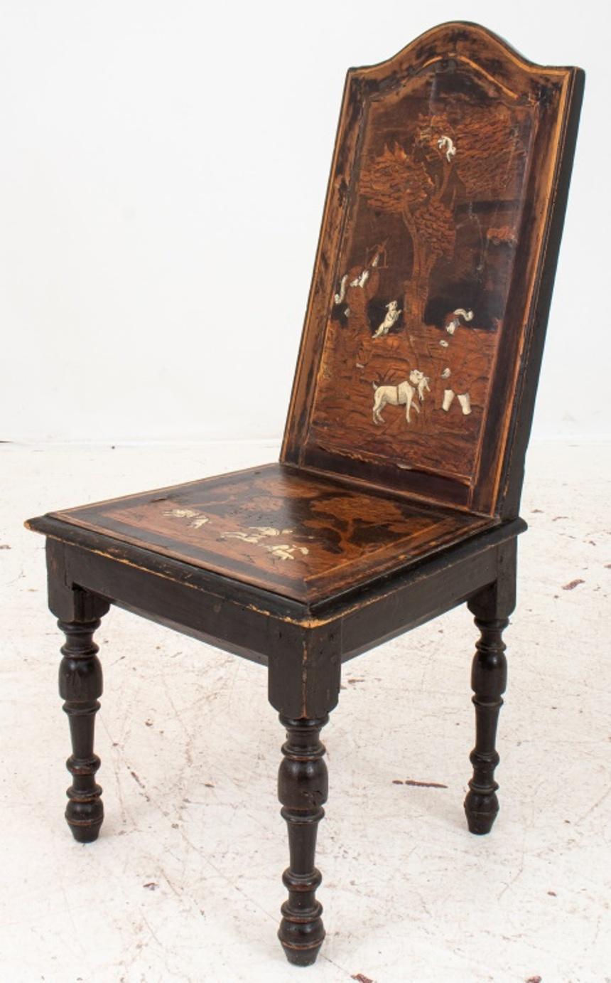 European parquetry hall chair, with bone inlay creating hunting scenes in the late Baroque taste, upon four turned legs, circa 1900.

Dealer: S138XX.