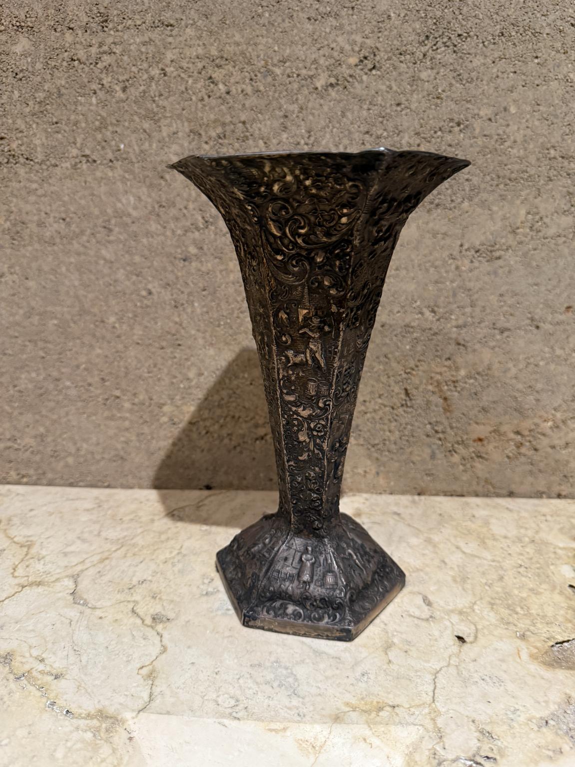 For your consideration an European peasant motif silver plated on repousse copper vase , Circa 1800s.

Stamped: Hallmark UJEP, H 309


Dimensions: 8.75 H x 5.5 diameter.

Please visit take a look at our listings, we have an amazing curated