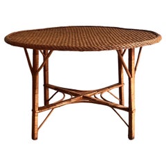 European Rattan Wicker Table from the 70s with sculpturel legs