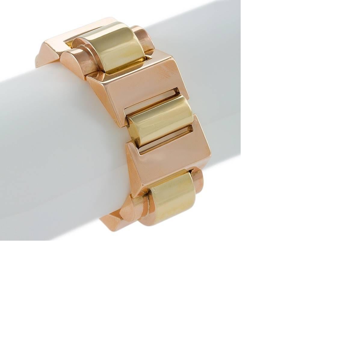 A European Retro 18 karat polished gold bracelet. The heavy link bracelet is composed of 6 triangular and 6 oval links in alternating pink and yellow polished gold.  Circa 1940's.

Following World War II, jewelry makers in Europe and America made