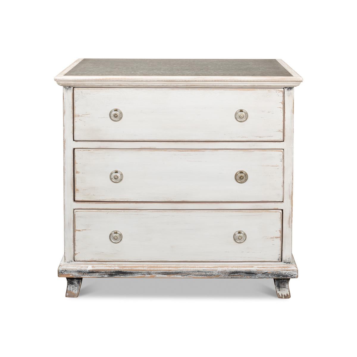 With three long drawers made of reclaimed pine in a hand-rubbed antiqued white painted finish, with zinc inlaid top. 

Dimensions: 35