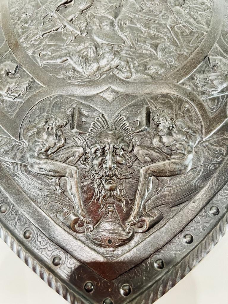 Hand-Carved European shield in bronze with careful chiseling depicting a battle circa 1700