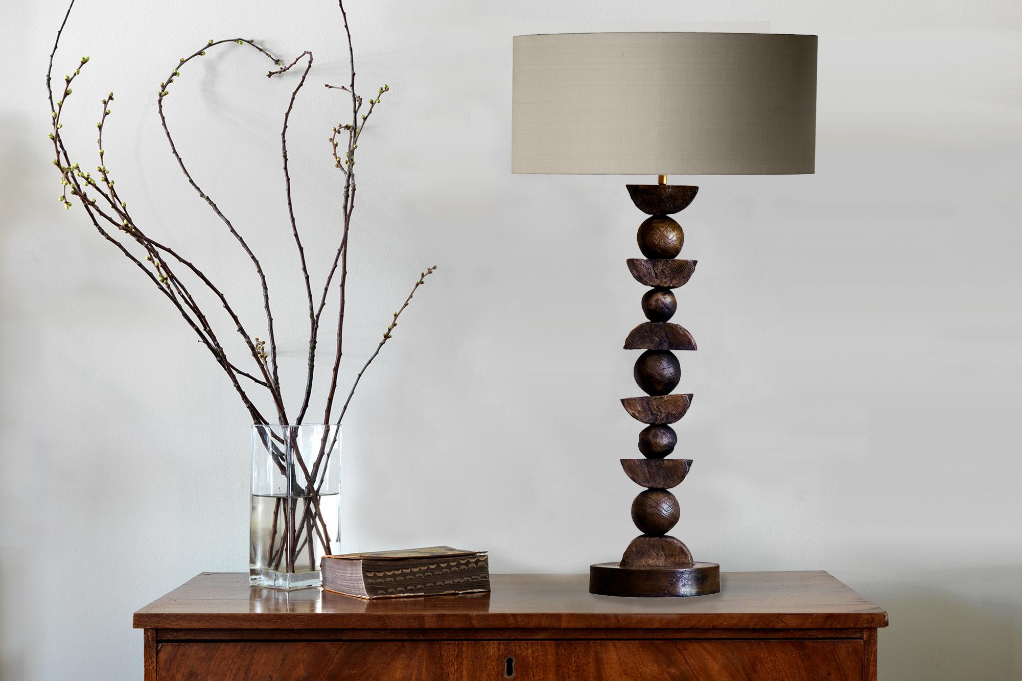 New collection: This contemporary Margit Wittig bronze table lamp sits on a round base . The material Wittig chose for this unique 21st century table lamp is Bronze , which gives this functional object of art a visual focus for luxury
