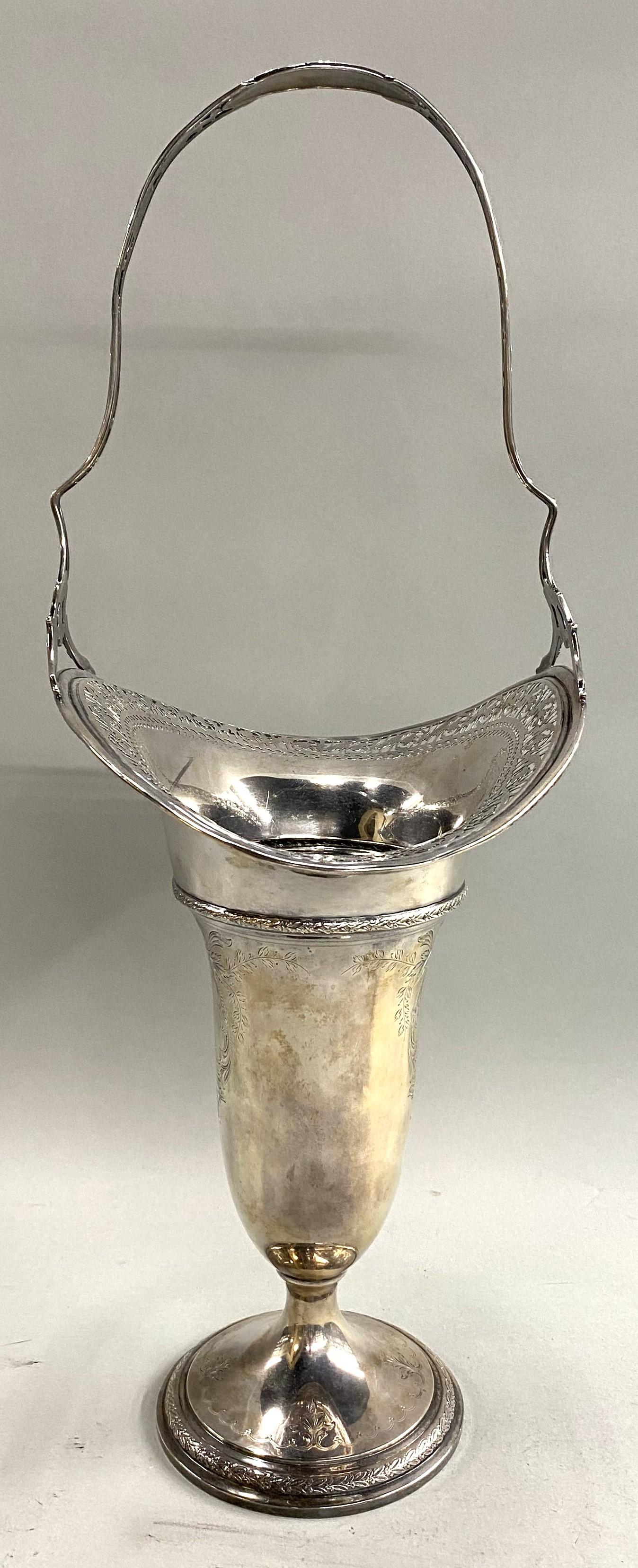 A fine European silver handled flower vase with reticulated flowing rim, adorned with foliate and scrollwork chased decoration on a round base. The silver was tested to be 800+ silver.  The unmarked vase probably dates to the late 19th or early 20th