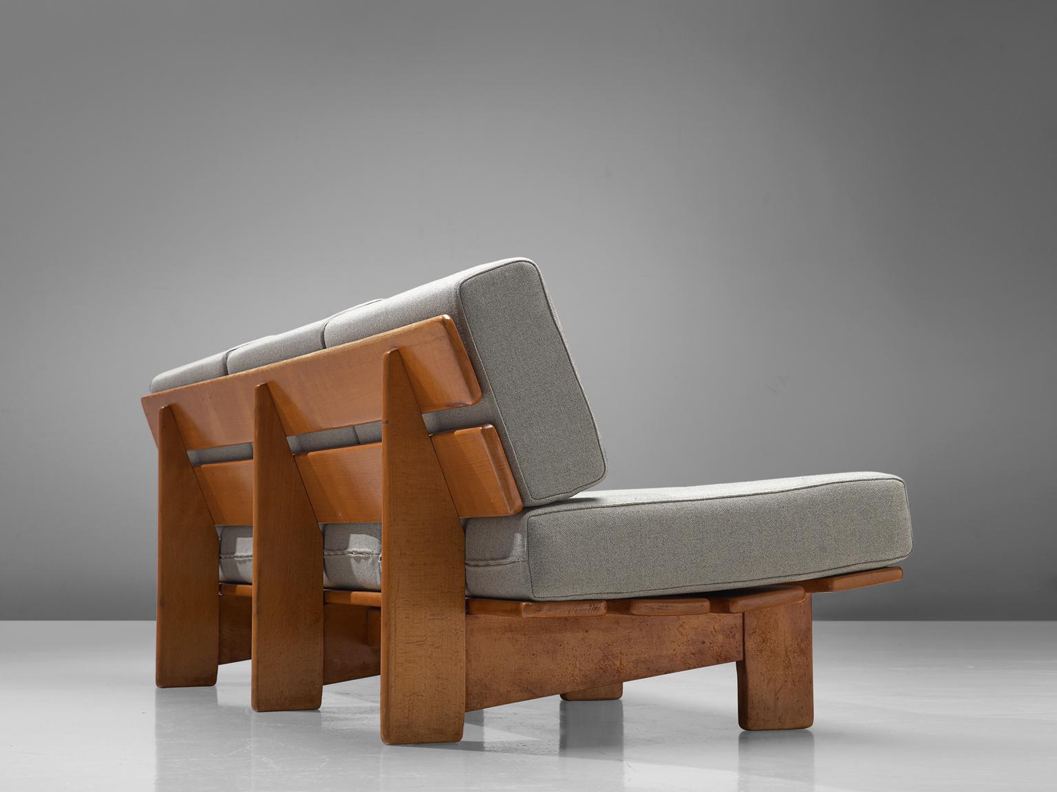Three-seat sofa, oak and fabric, Europe, 1950s.

Modest and simplistic three-seat sofa made in the 1950s. This sofa is made of oak, the sofa is build up with two slats for the backrest and four as the seat. Comfortable grey cushions are placed on