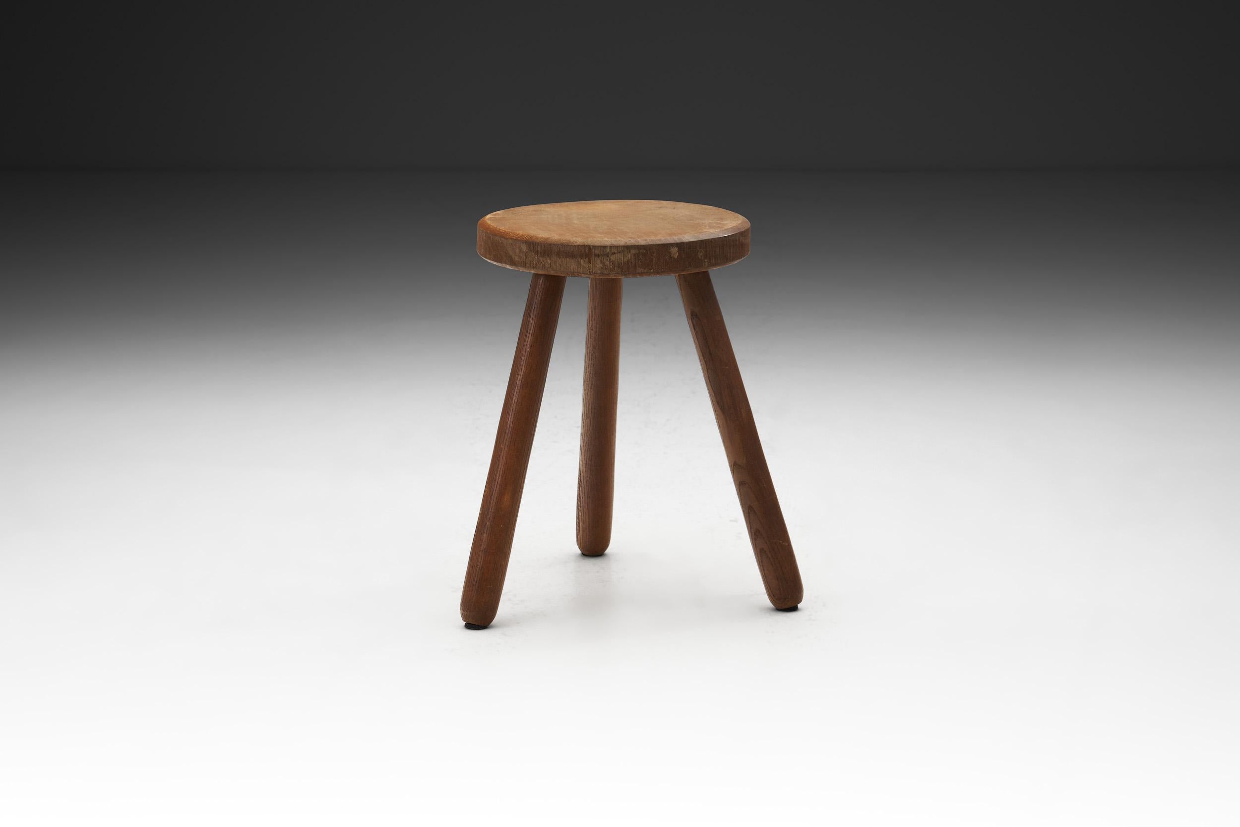 This lovely tripod stool is characterized by a minimal, clean approach that seeks to combine functionality with beauty. Its focus is on simple lines and light spaces, devoid of clutter.

Form and function collide in this stool, a piece of furniture