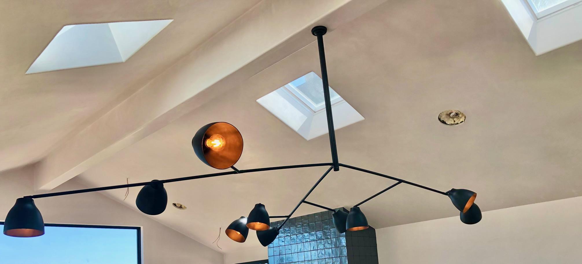 Multiple light and and Multiple Arm Chandelier with Directed shades and lights.  Customizable.  Multiple layers, etc.  This is the largest size Chandelier we can make in this style.  
