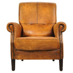 Fauteuil club européen en cuir brun clouté
