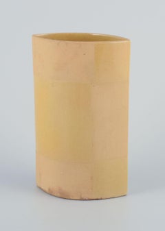 European studio ceramicist. Ceramic vase with yellow glaze. 1980s