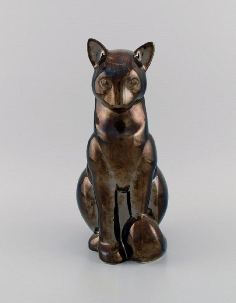 European studio ceramicist. Large cat in glazed ceramics. Beautiful metallic luster glaze. 
Edouard Marcel Sandoz style. 
Late 20th century.
Measures: 28 x 16 cm.
In excellent condition.